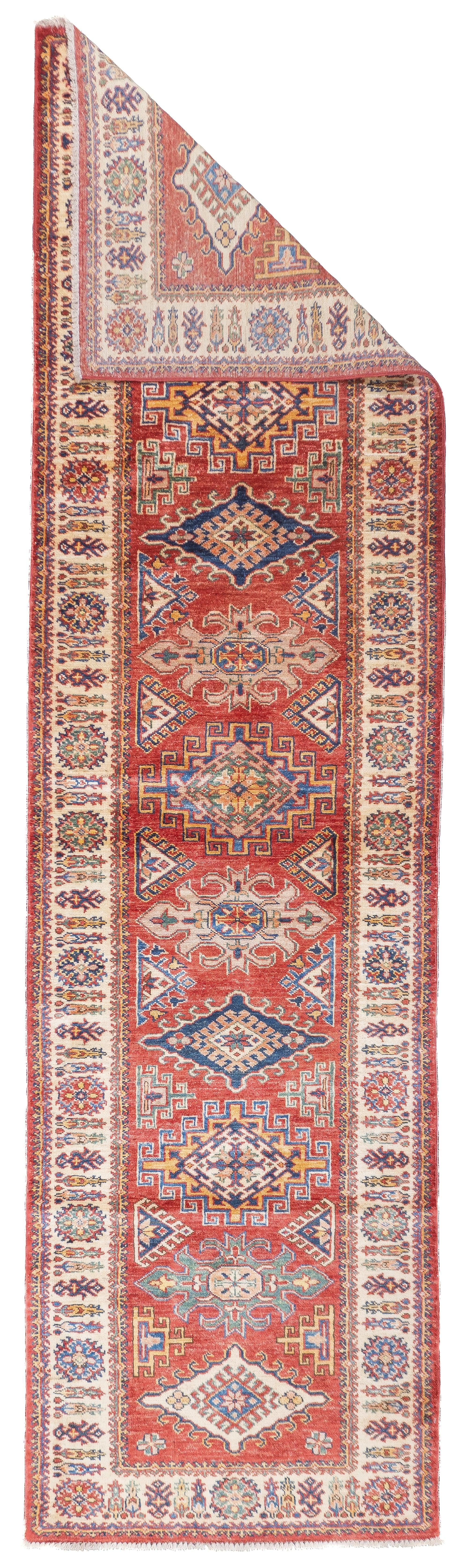 PAK Kazak Long Rug 2'7'' x 9'8''. SW Caucasus/Armenia. Boldly patterned, strongly coloured, totally geometric, all wool, coarse to moderate weave, medium to long pile, scatter format pieces, in medallion, allover and prayer (directional) layouts,