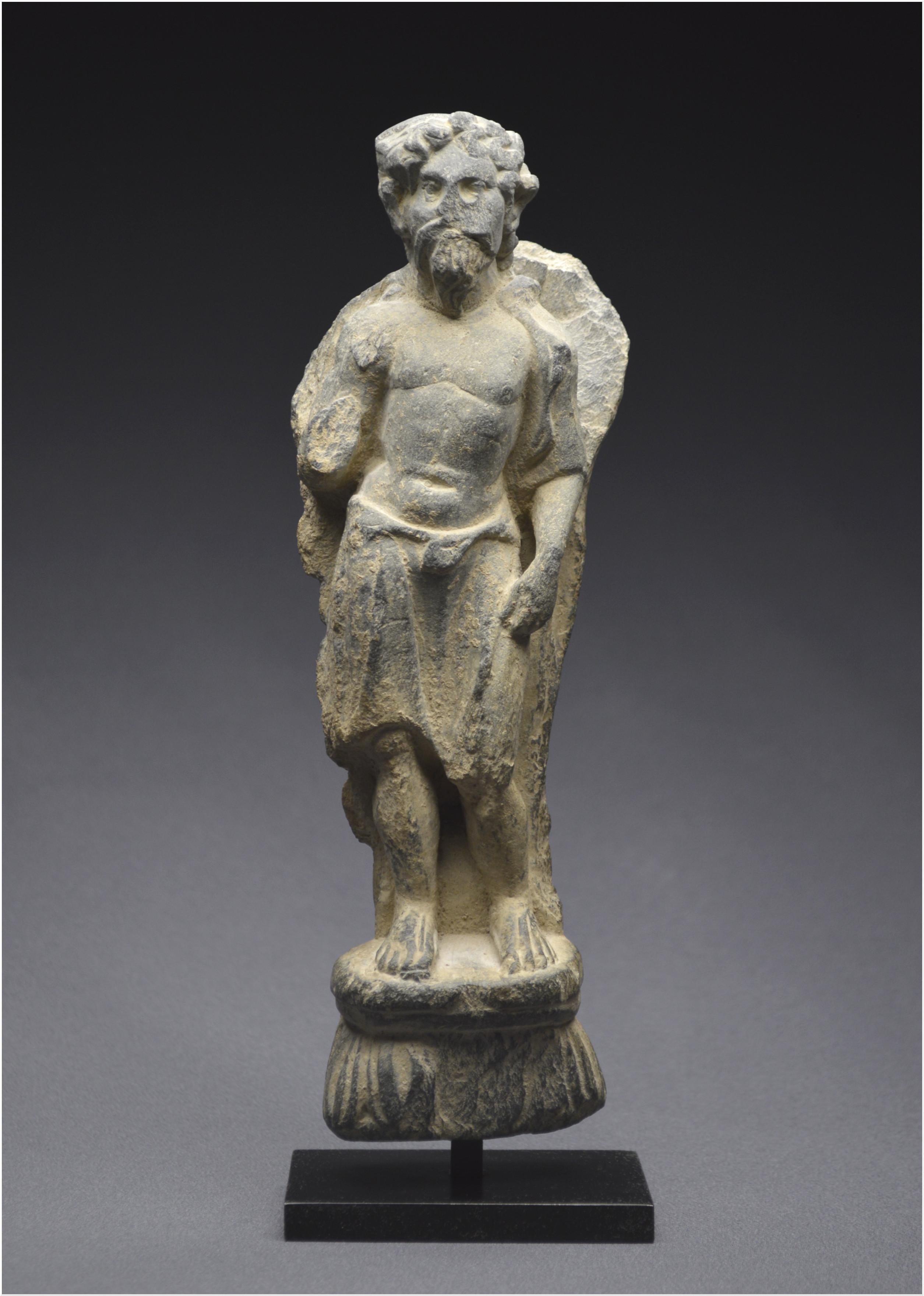 Pakistan / Region of Gandhara
2nd – 4th century AD


Representation of Vajrapani shown standing slightly swaying, the athletic body like a Hercules, the bare chest, the waist surrounded by a cloth. It rests barefoot on an ovoid base surmounting