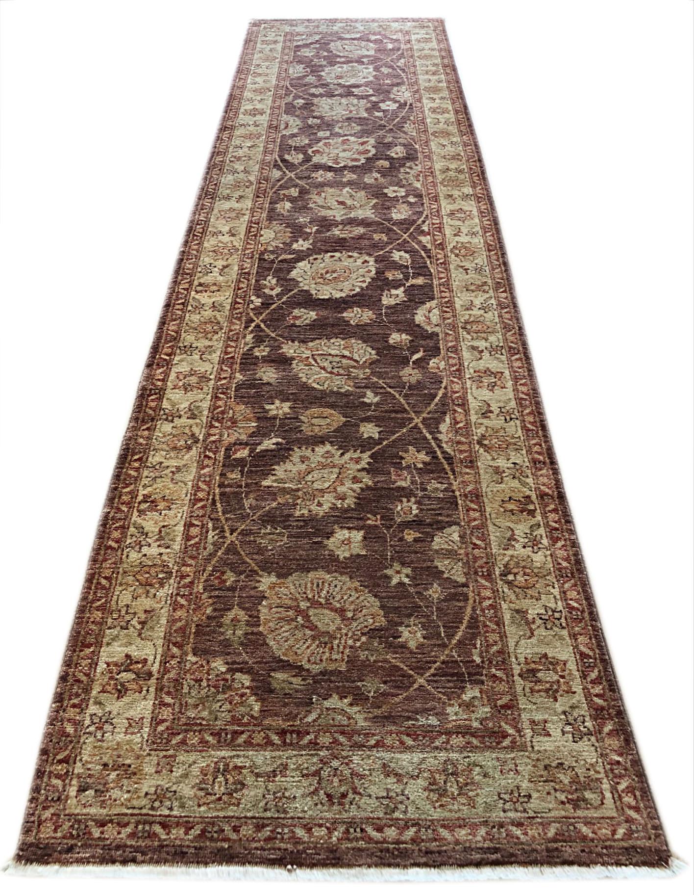 This Peshawar Pakistan rug is a finely knotted with a wool pile and cotton weft. The base color is brown and the border is light brown. The Peshawar rugs are in high demand across the market because their design, quality and color combination. This