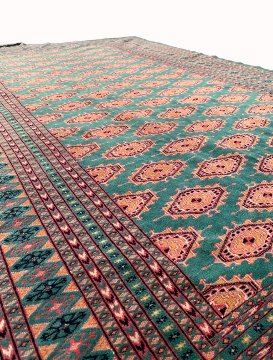 Pakistani Bukhara carpet from the 1970s, in orange and emerald green colors.

Ø cm 280 h cm 190

Bukhara-type rugs are named after the city of the same name in Uzbekistan. These kind of carpets has a clear link with tribal culture and style,