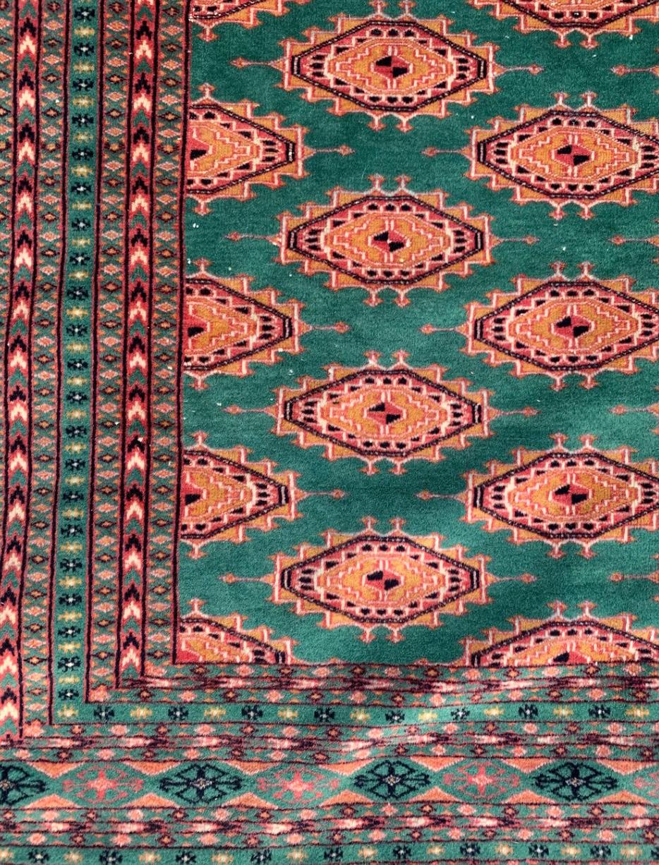 Tribal Pakistani Bukhara Carpet in Orange and Green from the 1970s For Sale