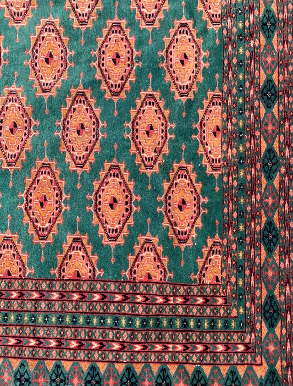 Late 20th Century Pakistani Bukhara Carpet in Orange and Green from the 1970s For Sale