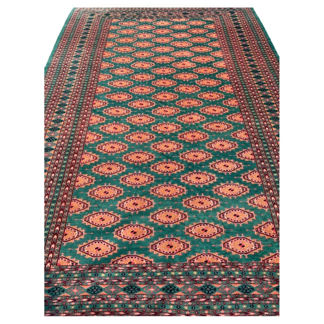 Pakistani Bukhara Carpet in Orange and Green from the 1970s