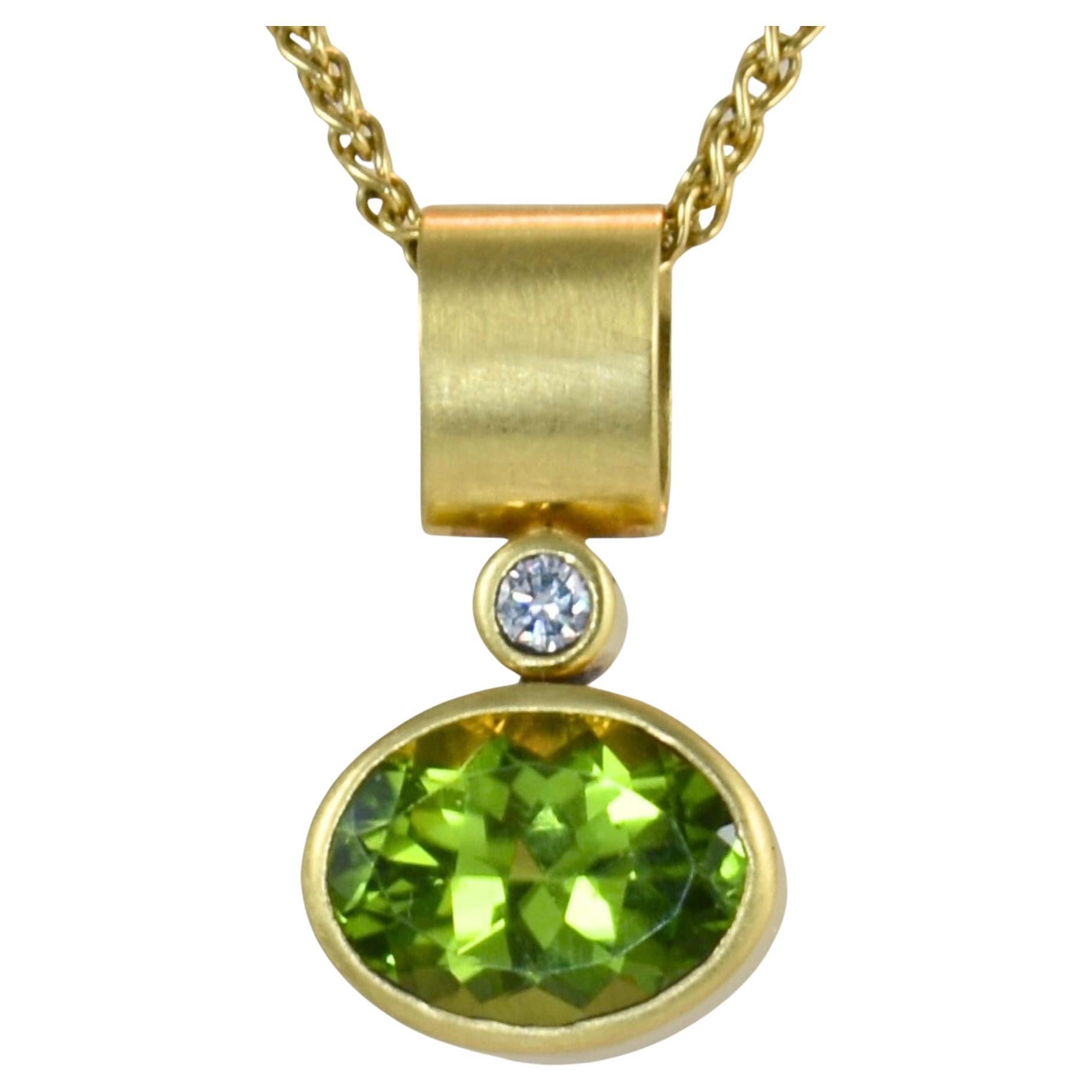 Discover the elegance of our Peridot Diamond Minimalist Pendant - an exquisite blend of radiant Pakistani peridot set in a luxurious satin 18K bezel, elevated with the dazzling twinkle of a brilliant diamond. This unique piece is meticulously