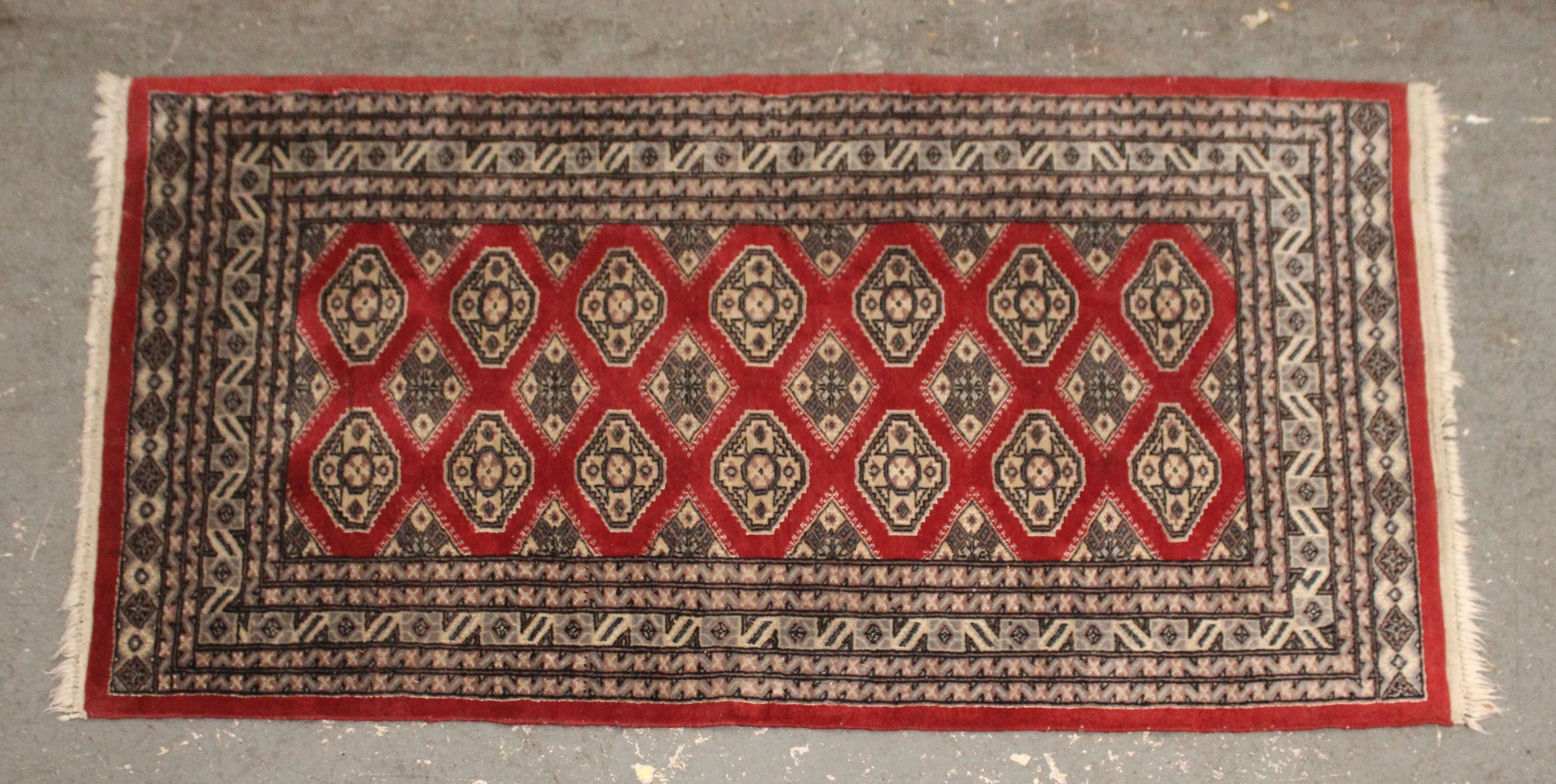This five foot rug is handwoven and dyed with red and blue throughout. The repeating diamond shapes are set over a vibrant red background.
Please confirm location NY or NJ