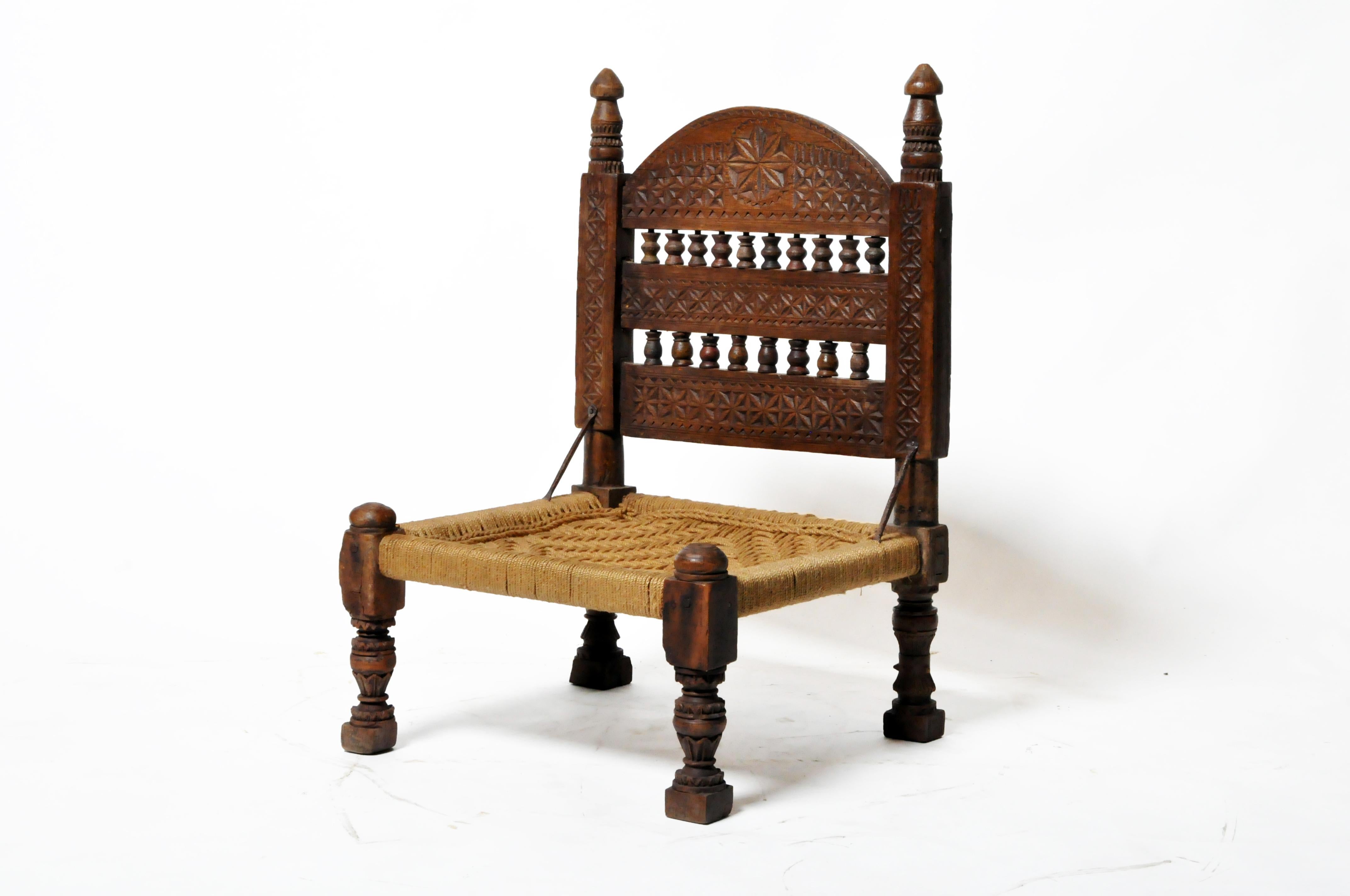 This low chair was favored by the inhabitants of the mountainous north of Pakistan; the Swat Valley. It dates to the early 20th century. The cord seat has been replaced. Wear consistent with age and use.
  