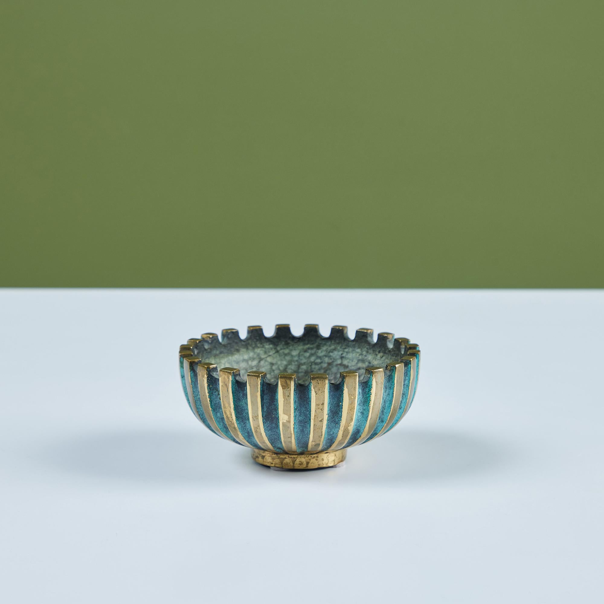 Mid-century cast bronze Pal Bell bowl. Features indented, ribbed exterior with alternating patinated bronze and verdigris stripes. The interior has a hand-hammered texture. An embossed stamp on the underside reads Pal-Bell Co. Made in