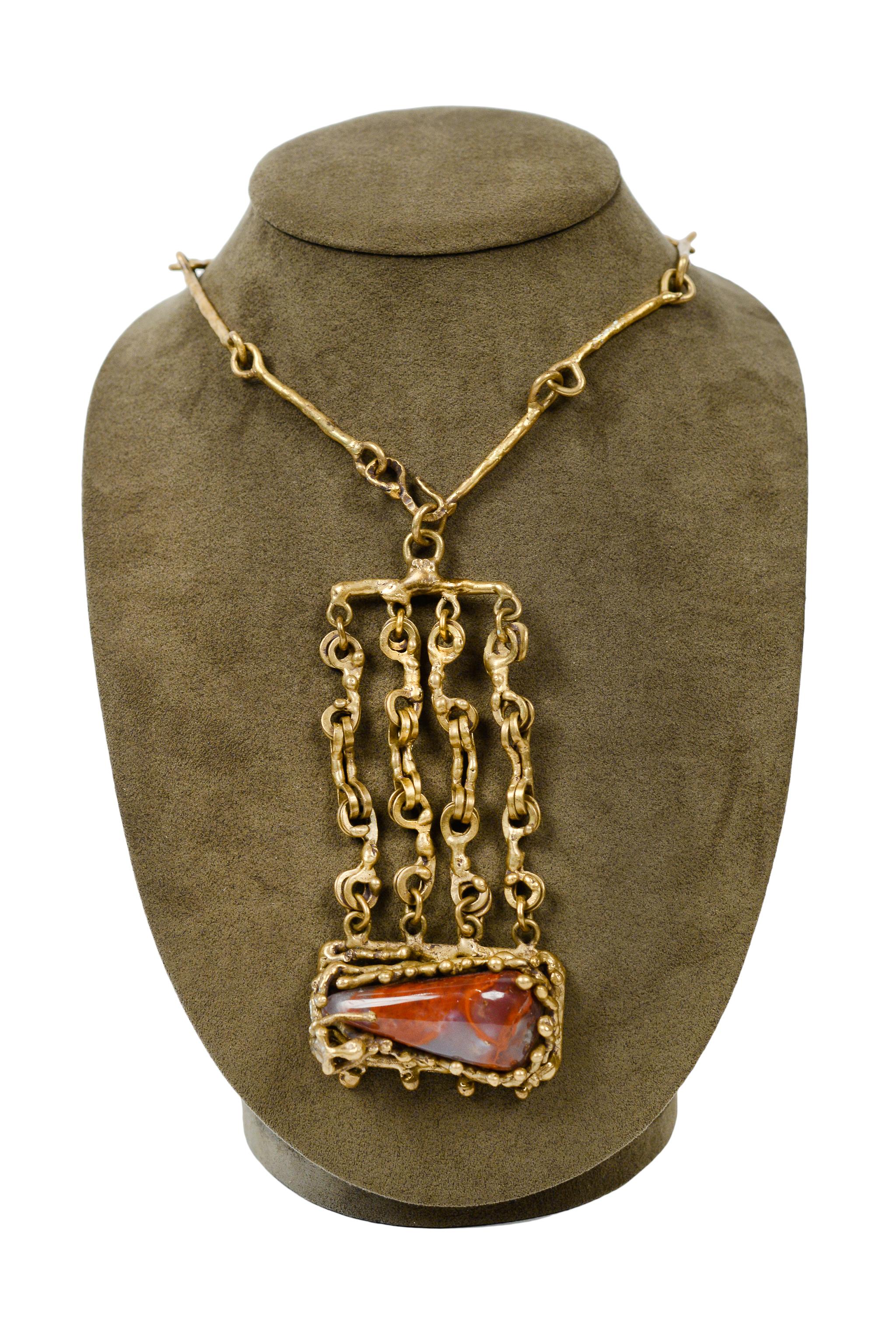 Resurrection Vintage is excited to offer a vintage Pal Kepenyes bronze and jasper biomorphic drippy modernist necklace featuring a handmade chain and links, a coral-like bezel with an abstract figure, and a polished burgundy jasper stone. 

Pal