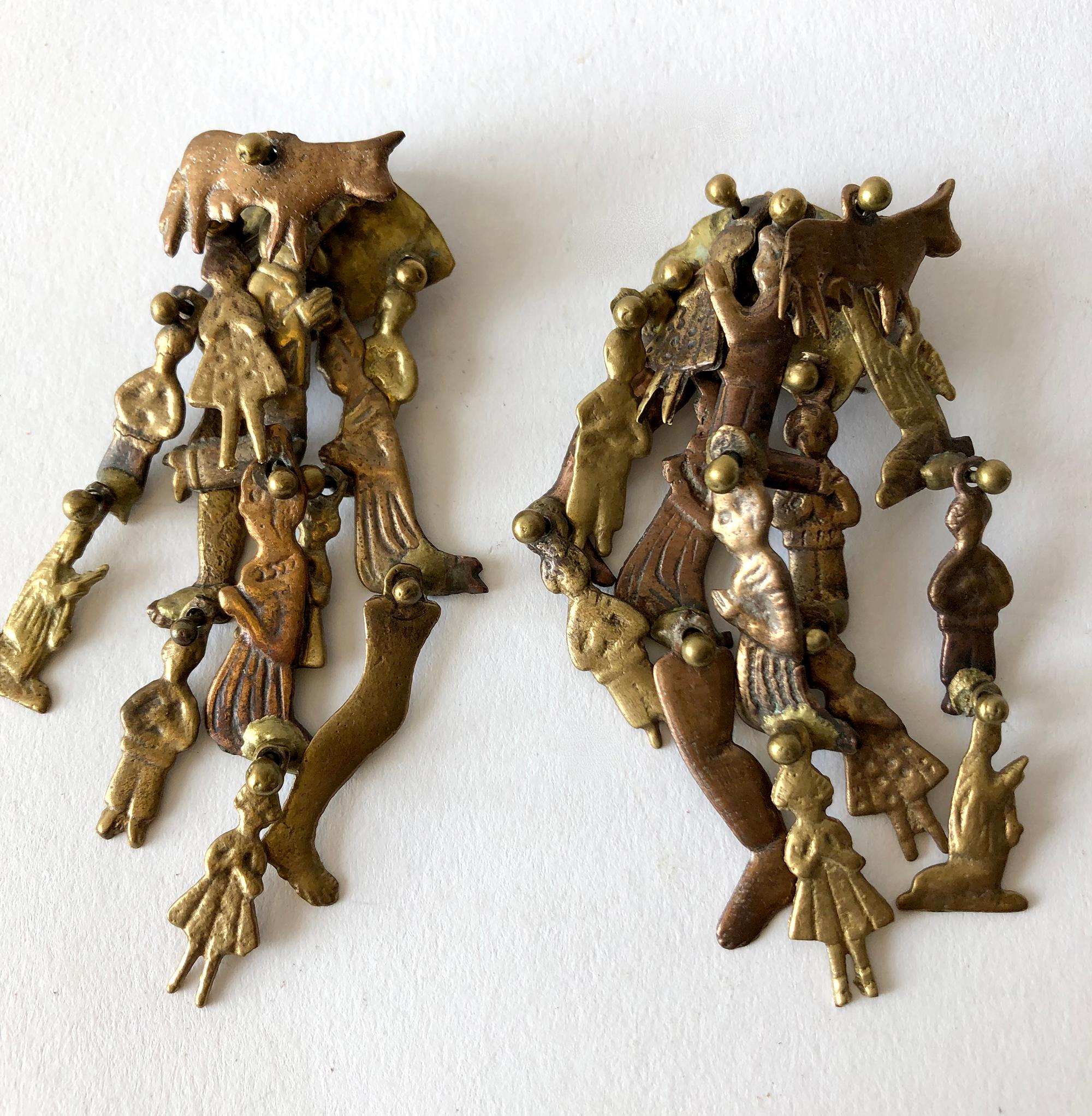 Bronze milagros dangling earrings created by Pal Kepenyes of Acapulco, Mexico.  Earrings measure 3.75