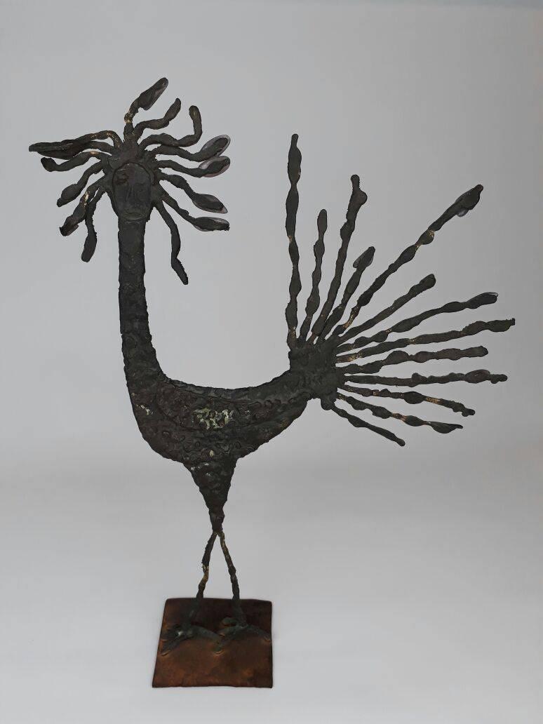 Pal Kepenyes bronze sculpture of a rooster with the face of a man, with amethyst stone stuck in its feathers. No signature.
  
A sculptor from Hungary who was nationalized Mexican, Pal Kepenyes resides in Acapulco where he has a studio. In his