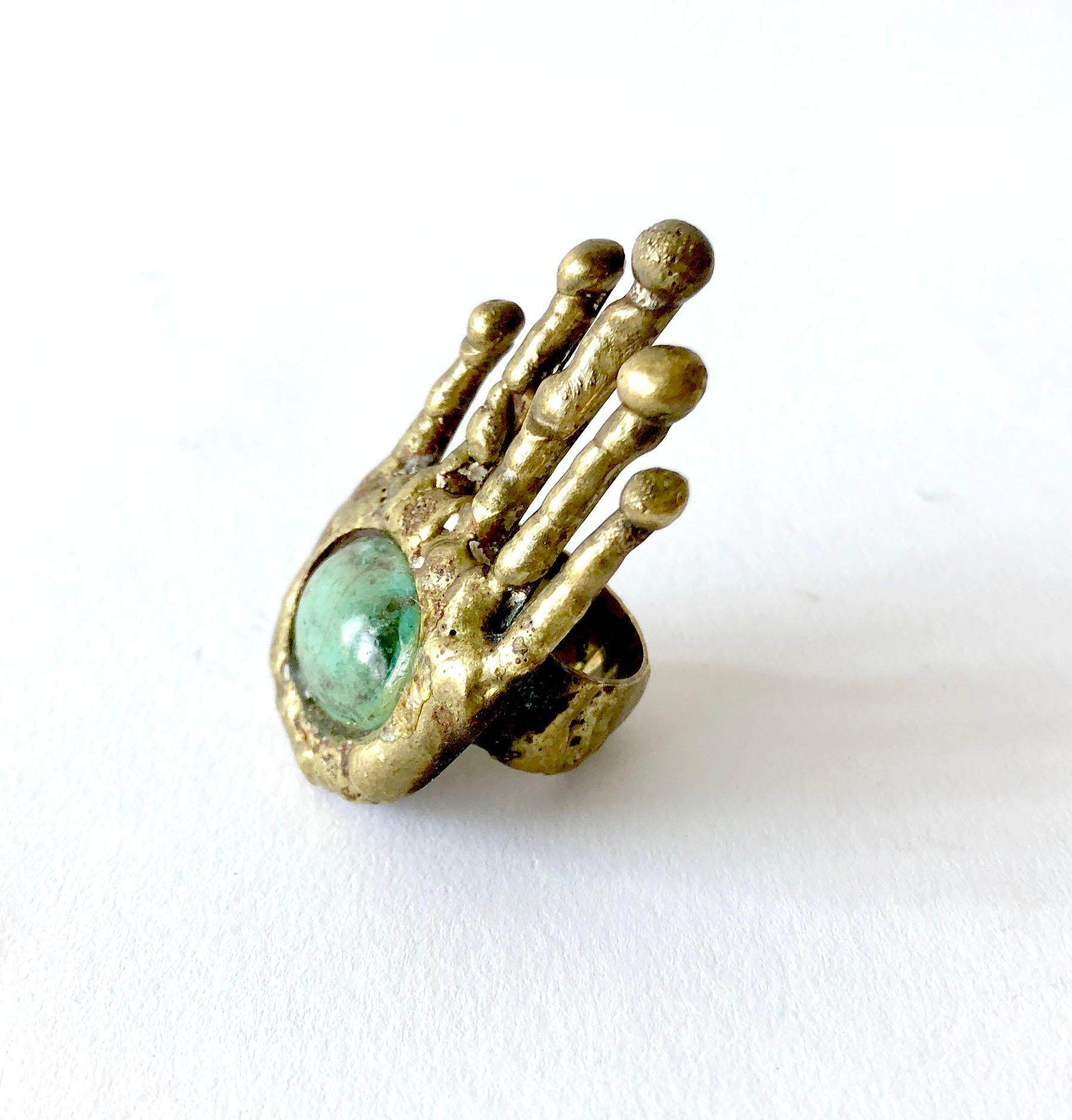 Surrealist bronze with Mexican turquoise accent hand ring by sculptor and jeweler Pal Kepenyes of Acapulco, Mexico.  Ring is a finger size 6.25.  Face of ring measures 2