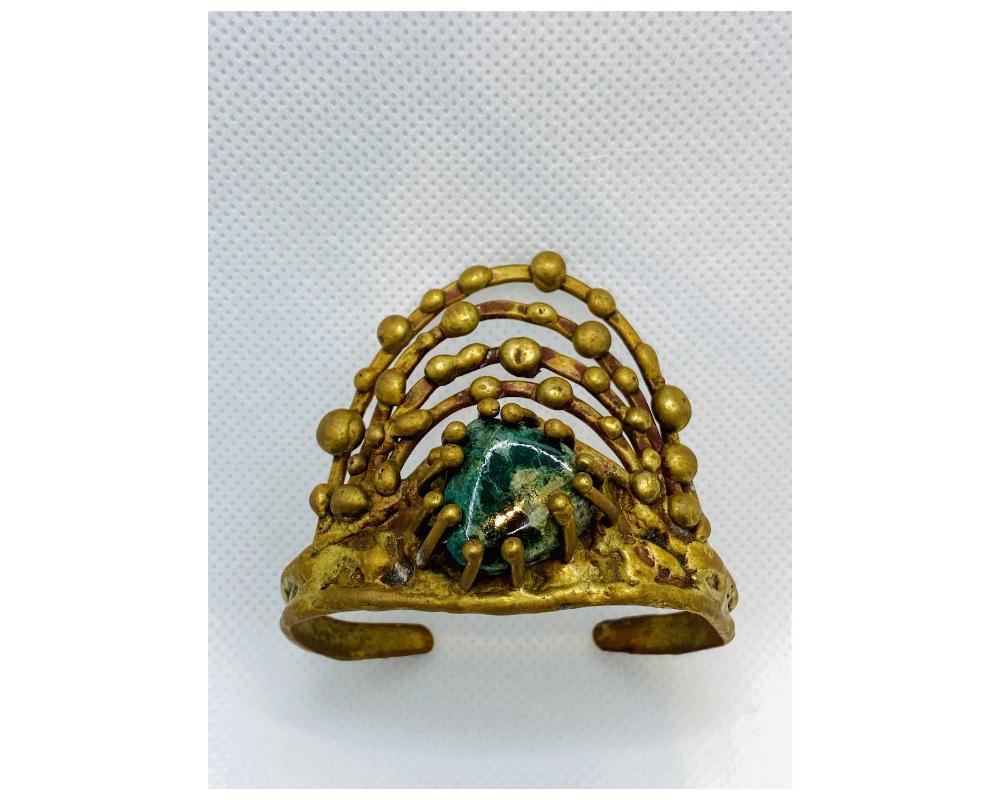 Pal Kepenyes Brutalist Bronze Bangle Cuff Jewelry Turquoise 
in good condition some minor dirt and scuffs do to age 
the Turquoise is in tact. 
size is approximately 2 1/2 inches wide from the base from top to bottom of the bangle head its