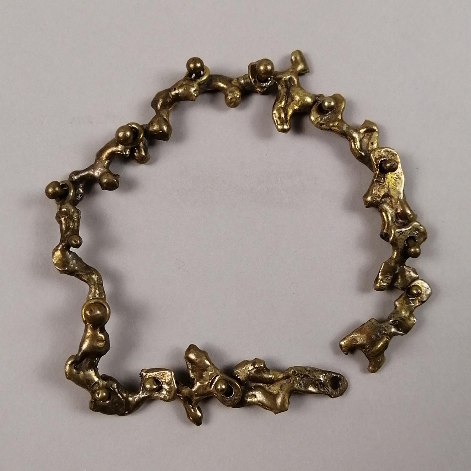 A sculptural Brutalist bronze bracelet by Hungarian-born Mexican artist Pal Kepenyes. The bracelet has an organic irregular design. 

Bracelet's wrist length: 24.5 cm. (9.5 inches).
Bracelet's width: 1.5 cm. (0.59 inches).
Weight: 37 g.

A sculptor