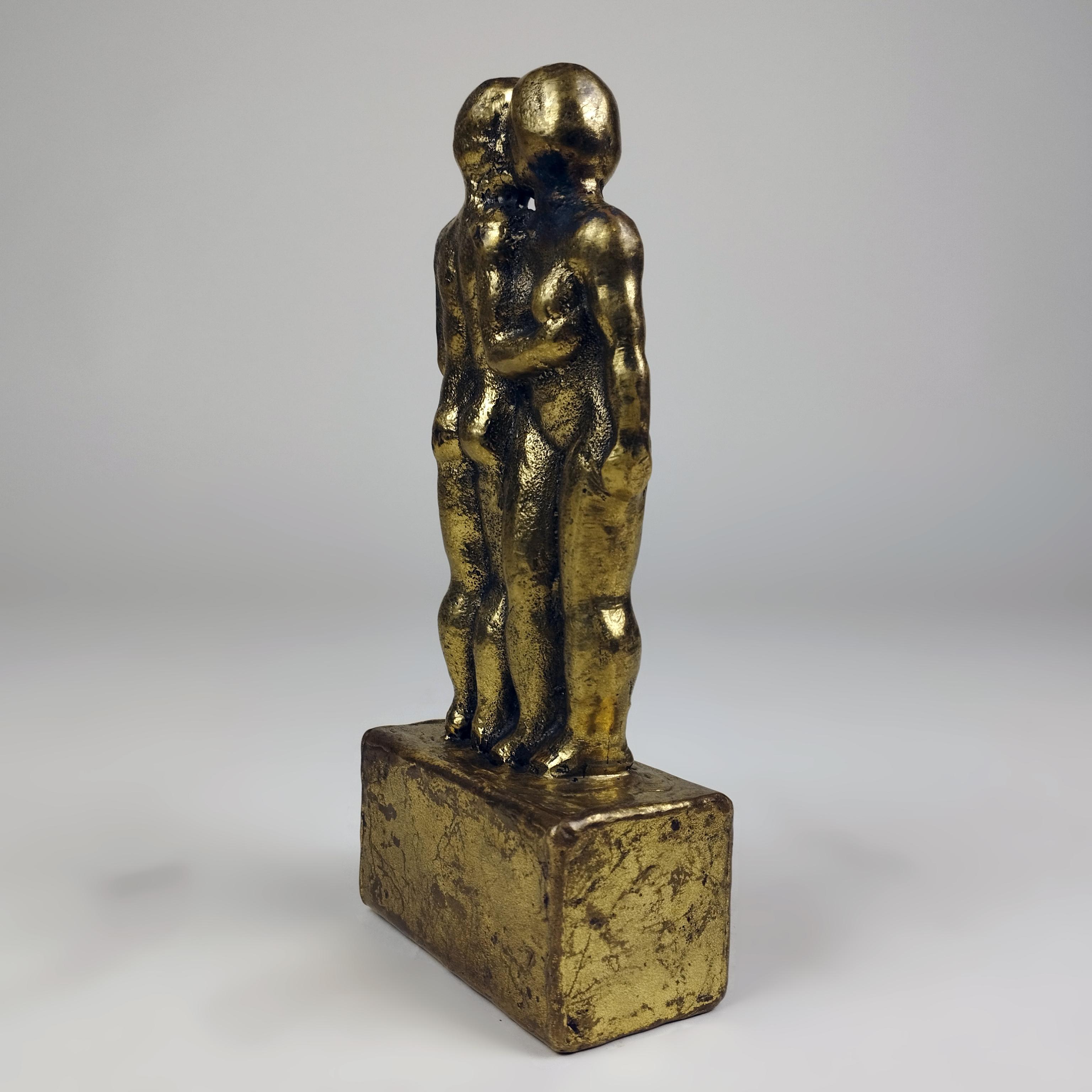 A Brutalist cast bronze sculpture with gilt steel base depicting a couple kissing by Hungarian-born Mexican artist Pal Kepenyes. The sculpture is signed on one of the base's sides.

A sculptor from Hungary who was nationalized Mexican, Pal Kepenyes