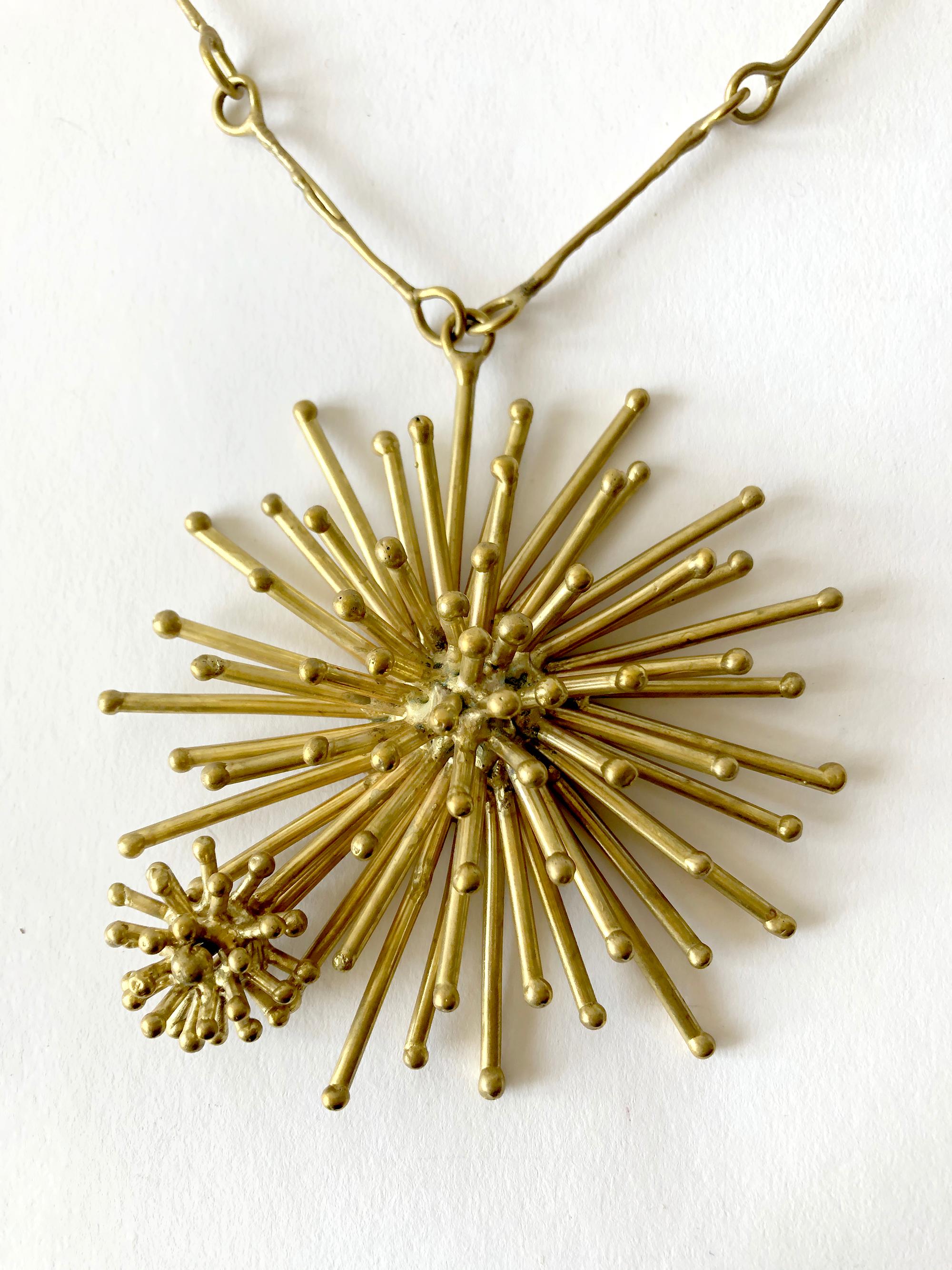 Gold plated bronze starburst necklace created by Pal Kepenyes of Acapulco, Mexico.  Pendant measures 4.75