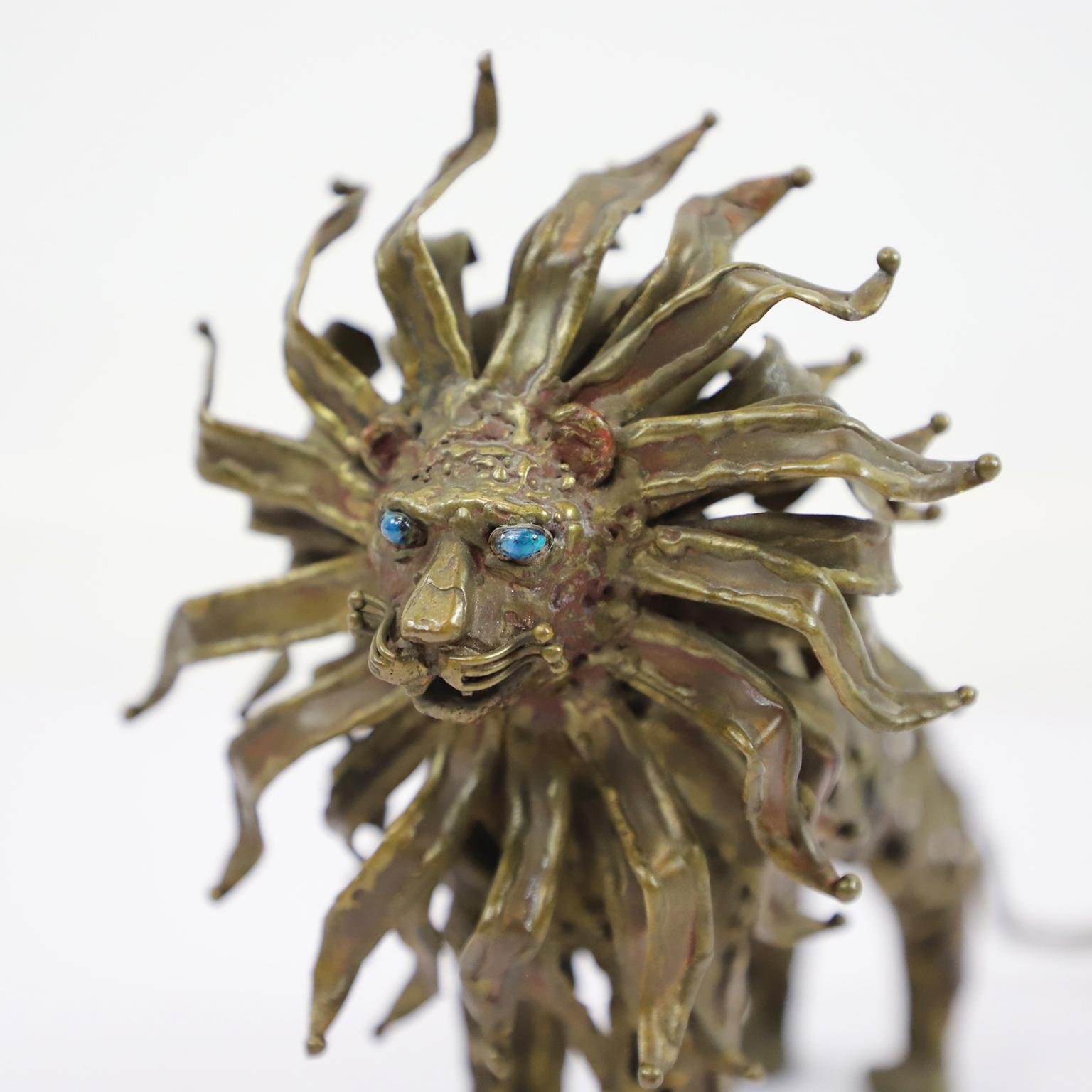 Circa 1970. We offer this Pal Kepenyes Lion Steel and Bronze Sculpture eyes made in semi-precious stone. 
Pal Kepenyes was a Hungarian artist and jewelry designer known for his unique and innovative designs. He was born in Budapest in 1926 and began