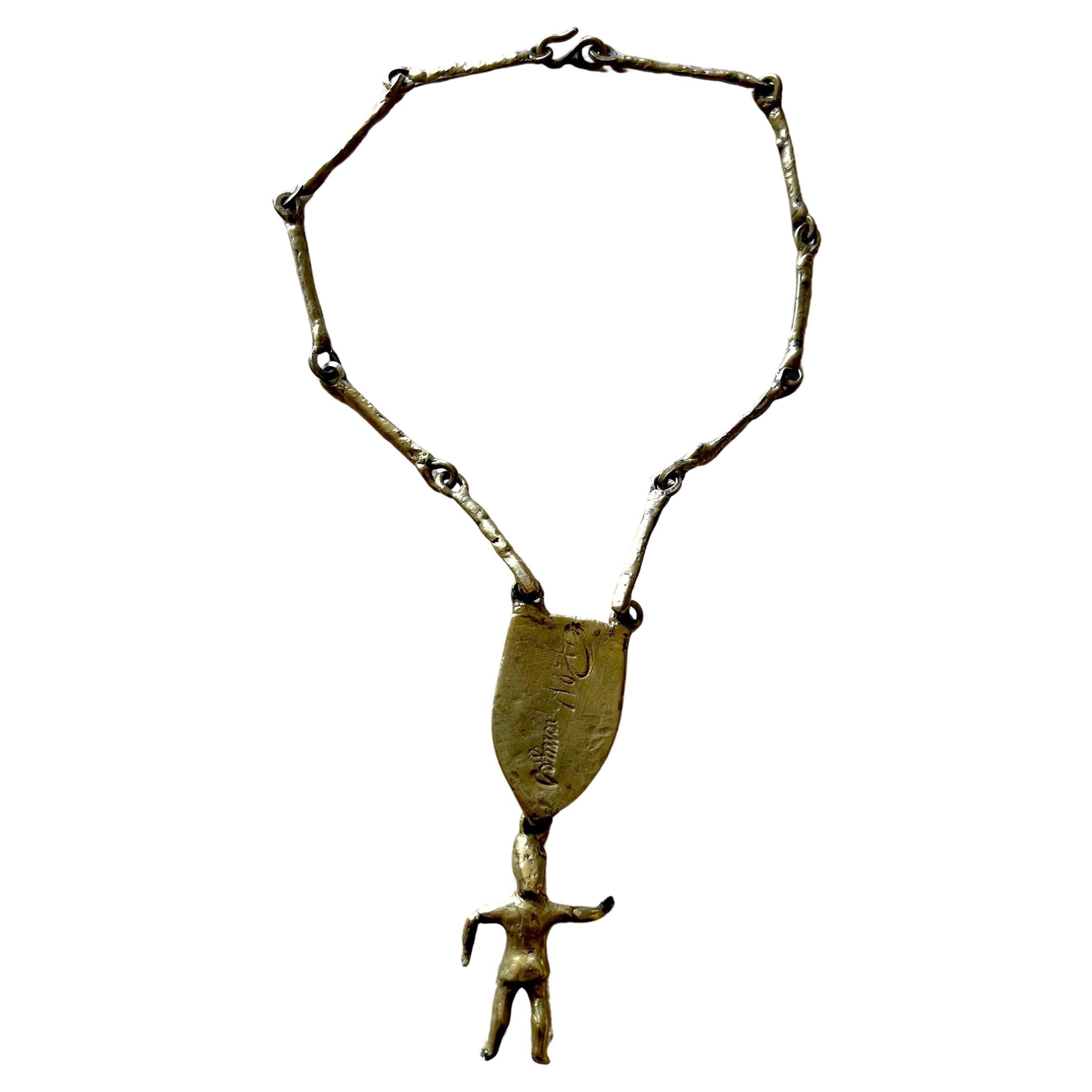 Handmade, one of a kind kinetic necklace designed by Pal Kepenyes of Acapulco, Mexico.  Large hinged pendant features a woman dangling from a large piece of chrysocolla or Mexican jade and signed in script 