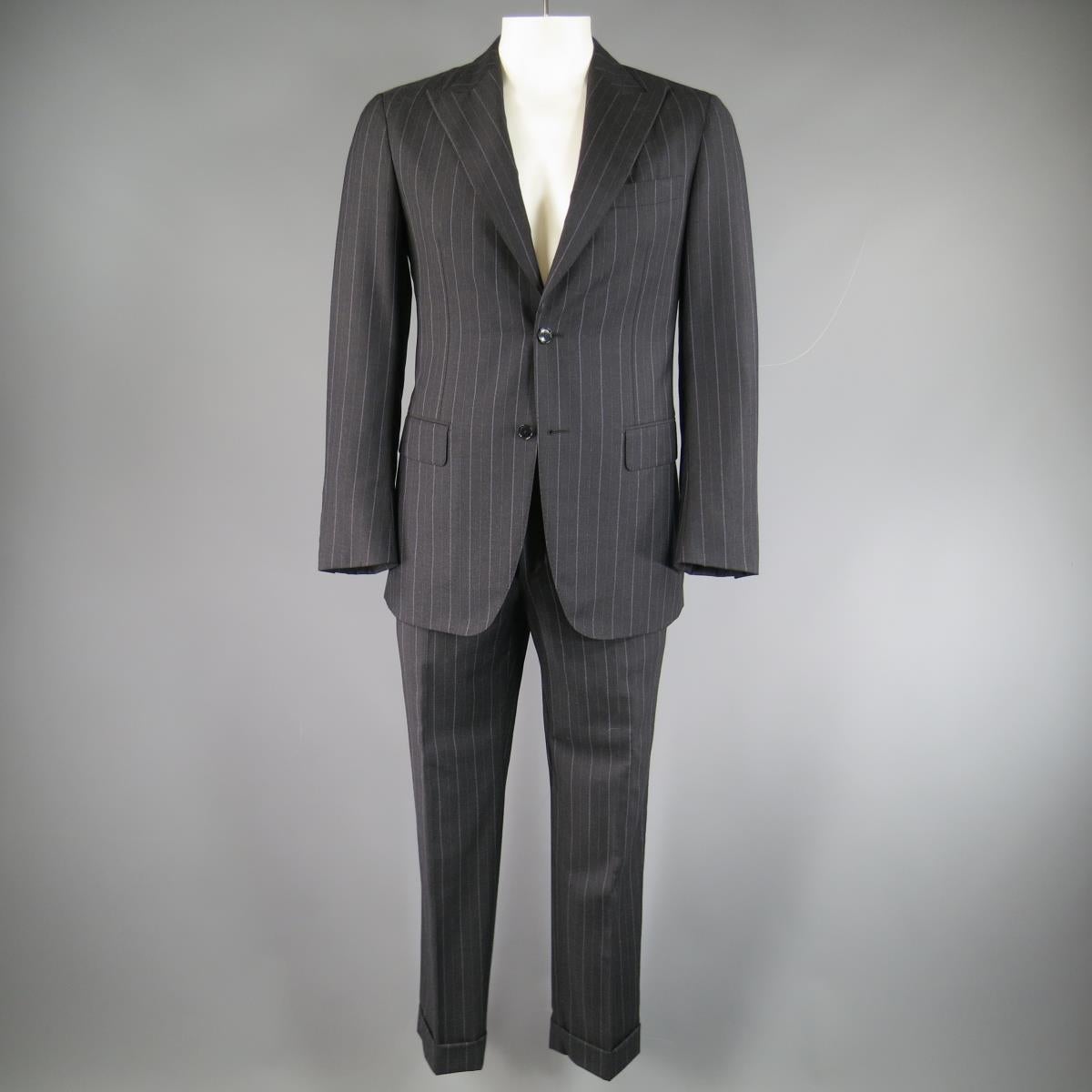 Classic PAL ZILERI suit in a charcoal gray wool cashmere blend with all over lavender chalk-stripe print includes a two button sport coat with wide peak lapel, flap pockets, functional button cuffs, and double vented back and matching tailored, flat