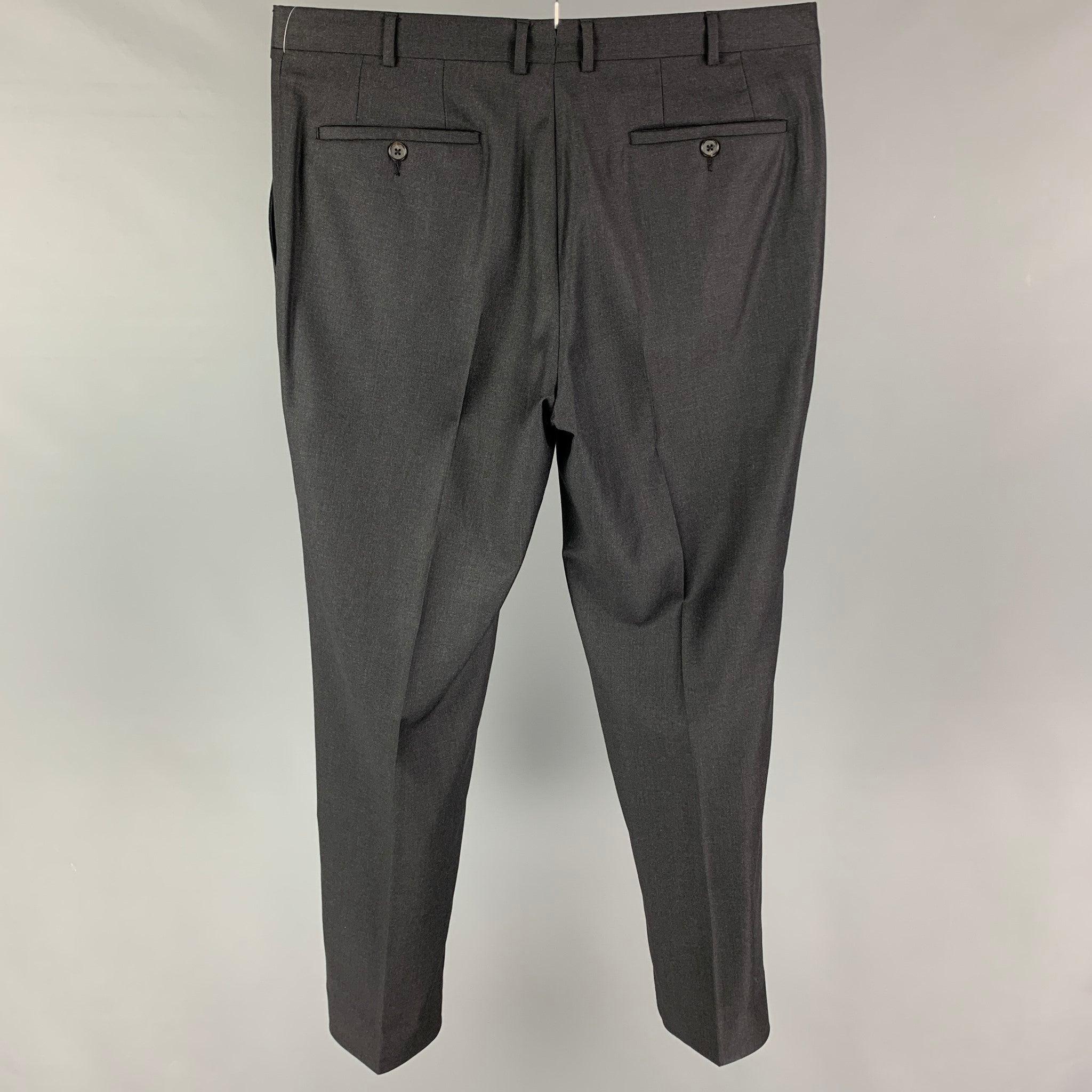 PAL ZILERI dress pants comes in a charcoal virgin wool featuring a flat front, zip fly, and a double button closure.
Very Good
Pre-Owned Condition. 

Marked:   52 

Measurements: 
  Waist: 36 inches  Rise: 10 inches  Inseam: 31 inches 

  
  
