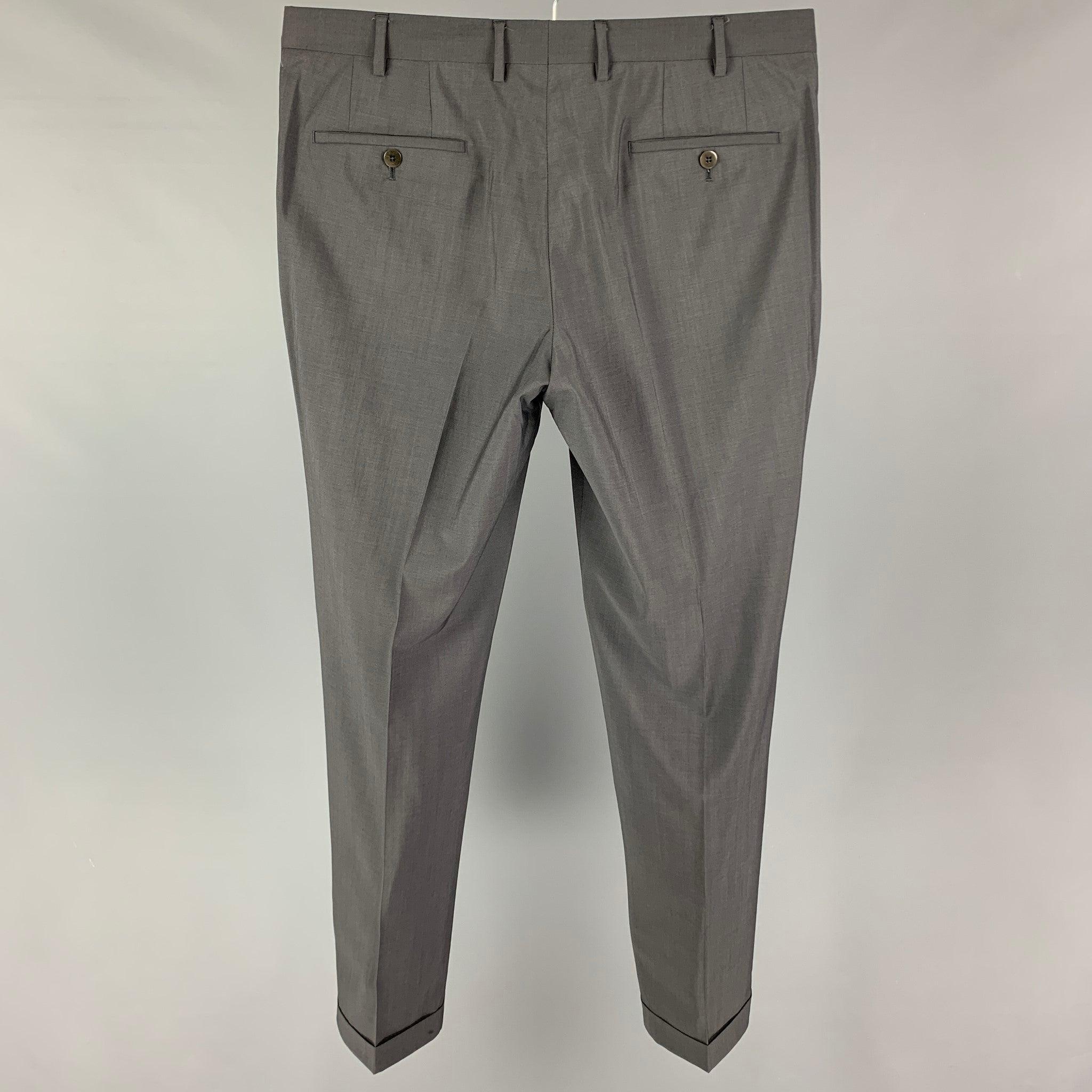 PAL ZILERI dress pants comes in a grey wool blend featuring a flat front, cuffed leg, and a zip fly closure.Very Good
Pre-Owned Condition. 

Marked:   52  

Measurements: 
  Waist: 36 inches  Rise: 10 inches  Inseam: 32 inches 

  
  
 
Reference: