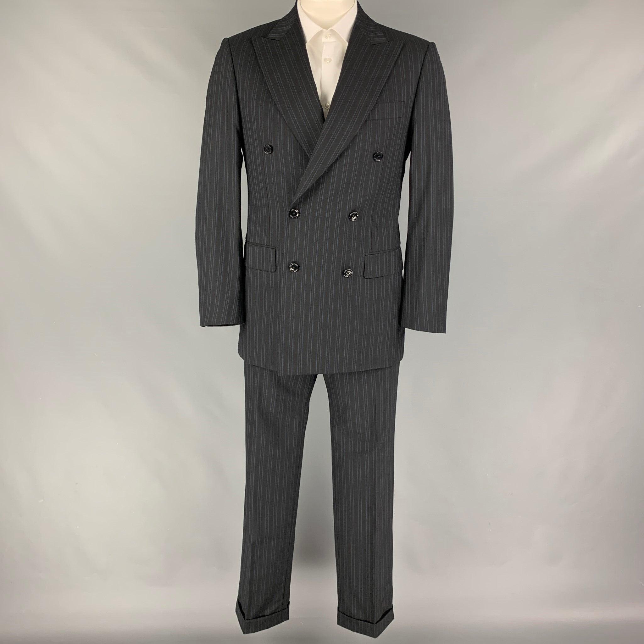 PAL ZILERI
suit comes in a black & blue stripe wool with a full liner and includes a double breasted sport coat with a peak lapel and matching cuffed flat front trousers. Made in Italy. Very Good Pre-Owned Condition. 

Marked:   50 

Measurements: 
