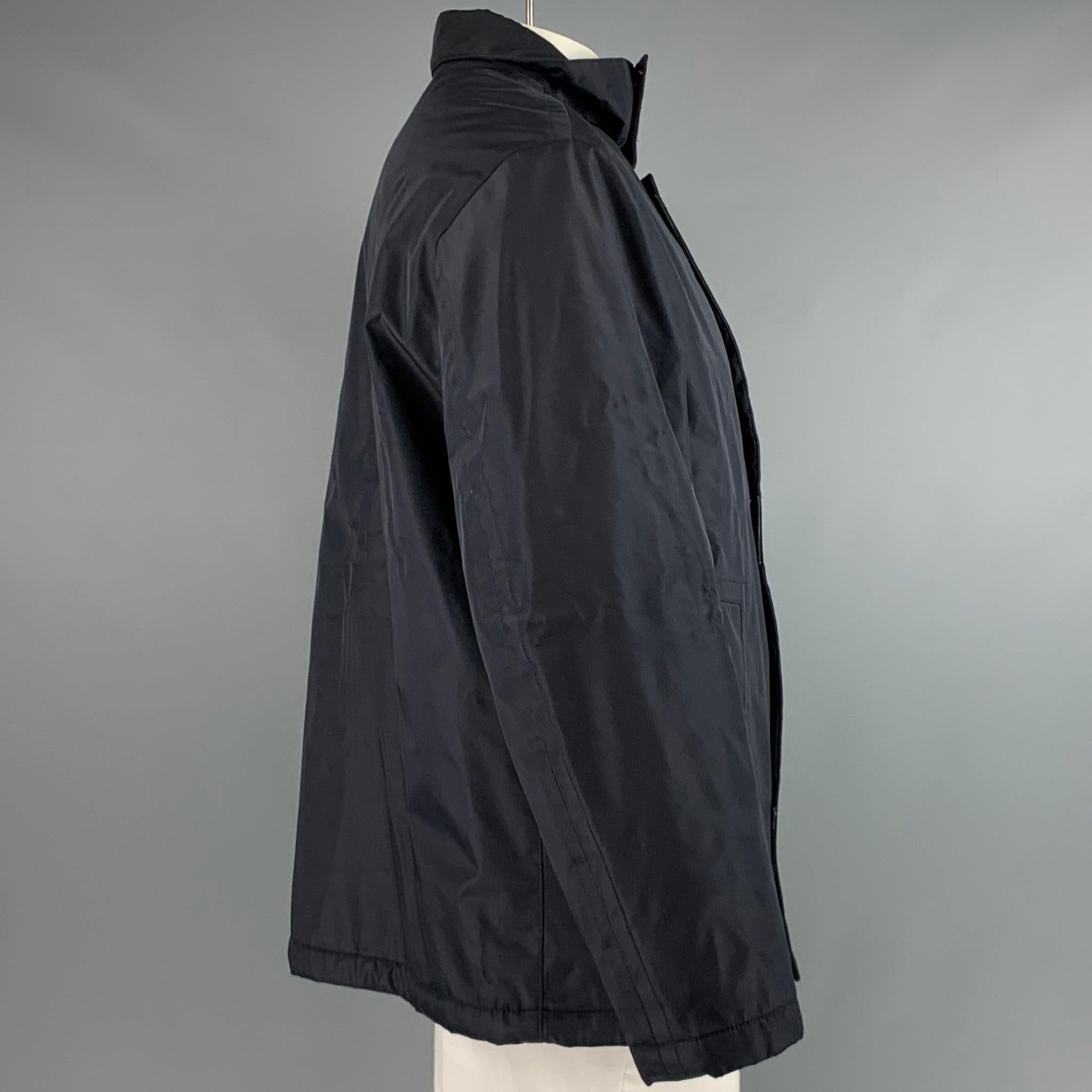 PAL ZILERI jacket in a navy polyester blend fabric featuring two exterior pockets, and a zip up style with self-fastening closure. Made in Italy.Excellent Pre-Owned Condition. 

Marked:   52 

Measurements: 
 
Shoulder: 19.5 inches Chest: 44 inches