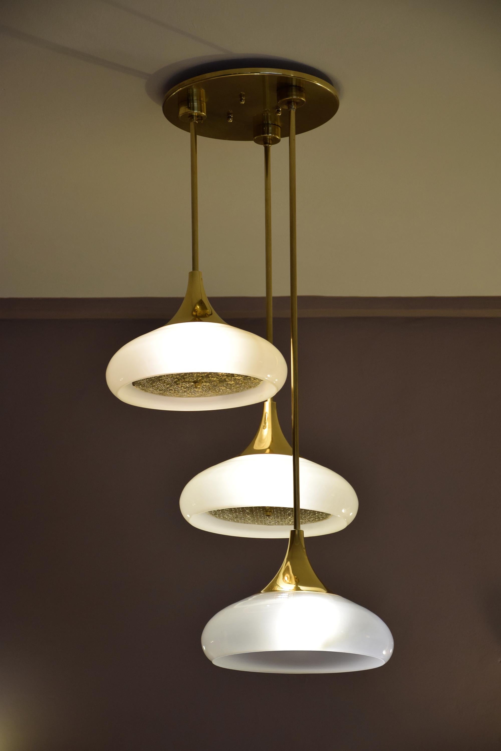 Three hanging lights designed in a solid brass structure and organic opal glass shades. The openwork brass sheets underneath are optionable.

Flow 2 by JA Studio
The inspiration behind this collection was to create modern designs with modular