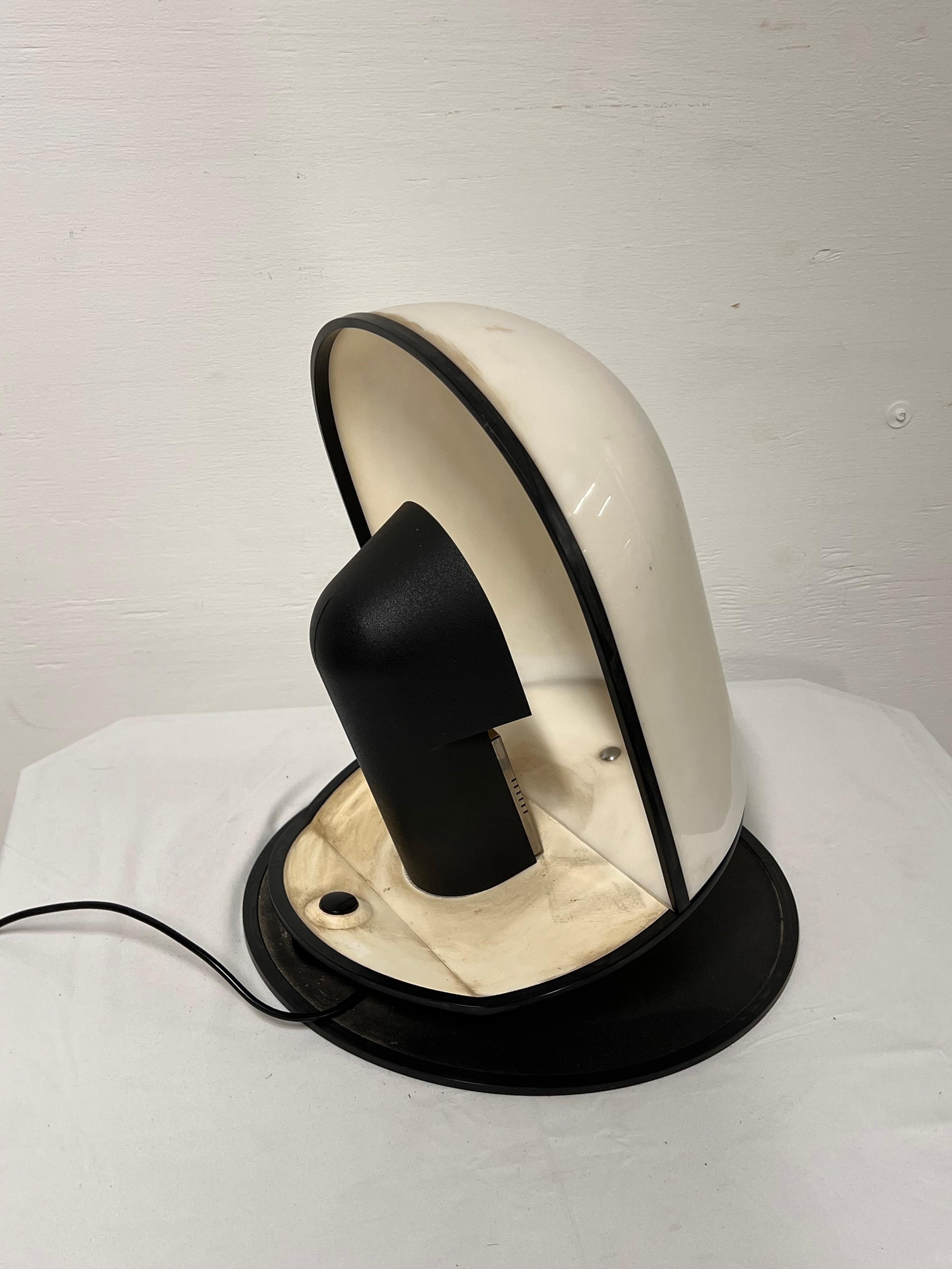 Big table lamp designed by Danilo & Corrado Airoldi for Luci Milano during the 1970s. Known as Pala, it is made by white perspex with black iron details.
Needs to be rewired 
May need minor restoration 