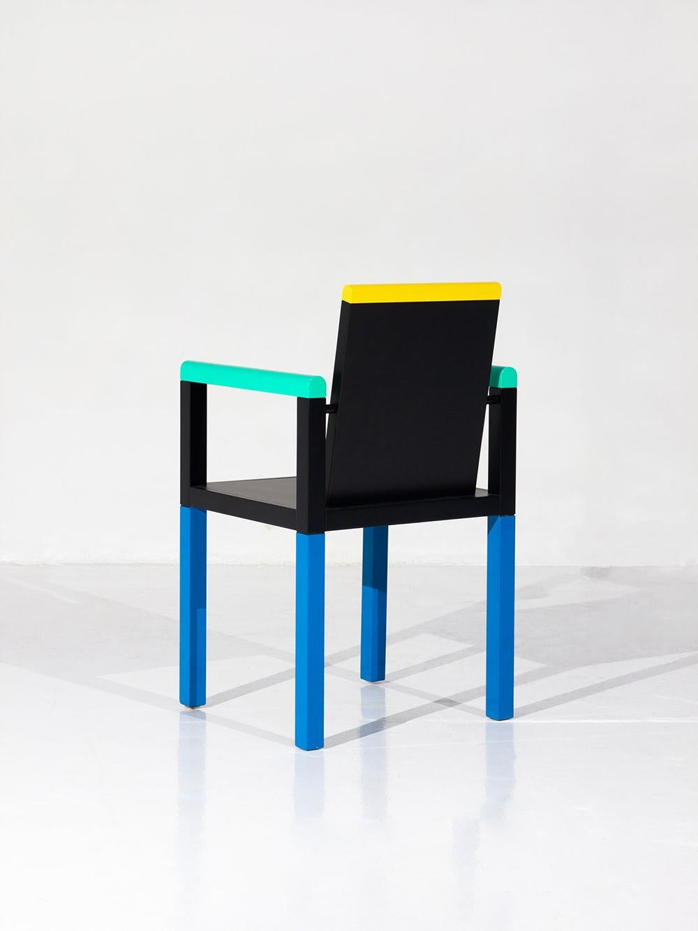 PALACE Chair, Designed by George J. Sowden in 1983 for the Collection Memphis Milano, in colored lacquered wood. 
It has a stamp on the reverse.