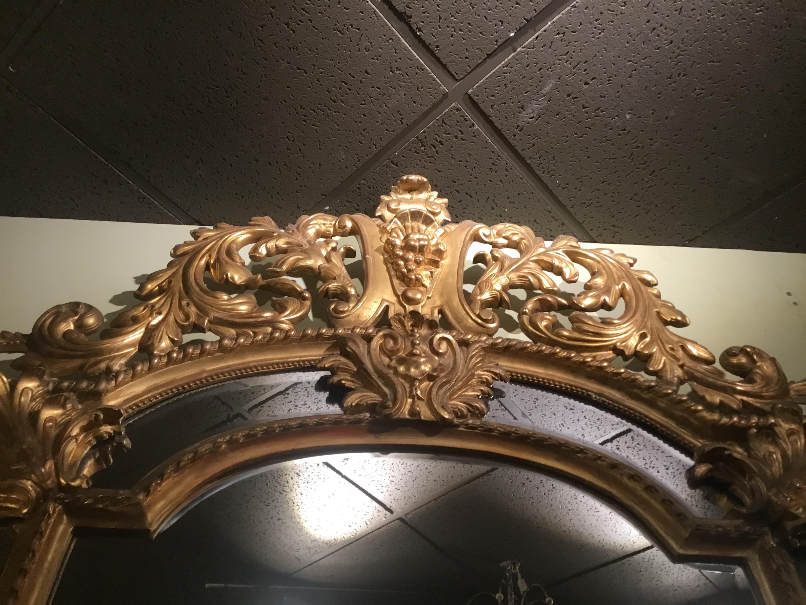 Hand-Carved Palace Size Giltwood Rococo Style Cushion Mirror Beveled with Floral Designs For Sale