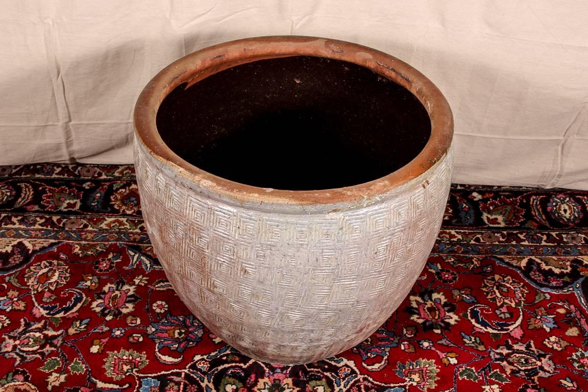 Palace size pottery planter with embossed geometric all over pattern.

Condition: Expected wear and signs of use including some light surface scratching.