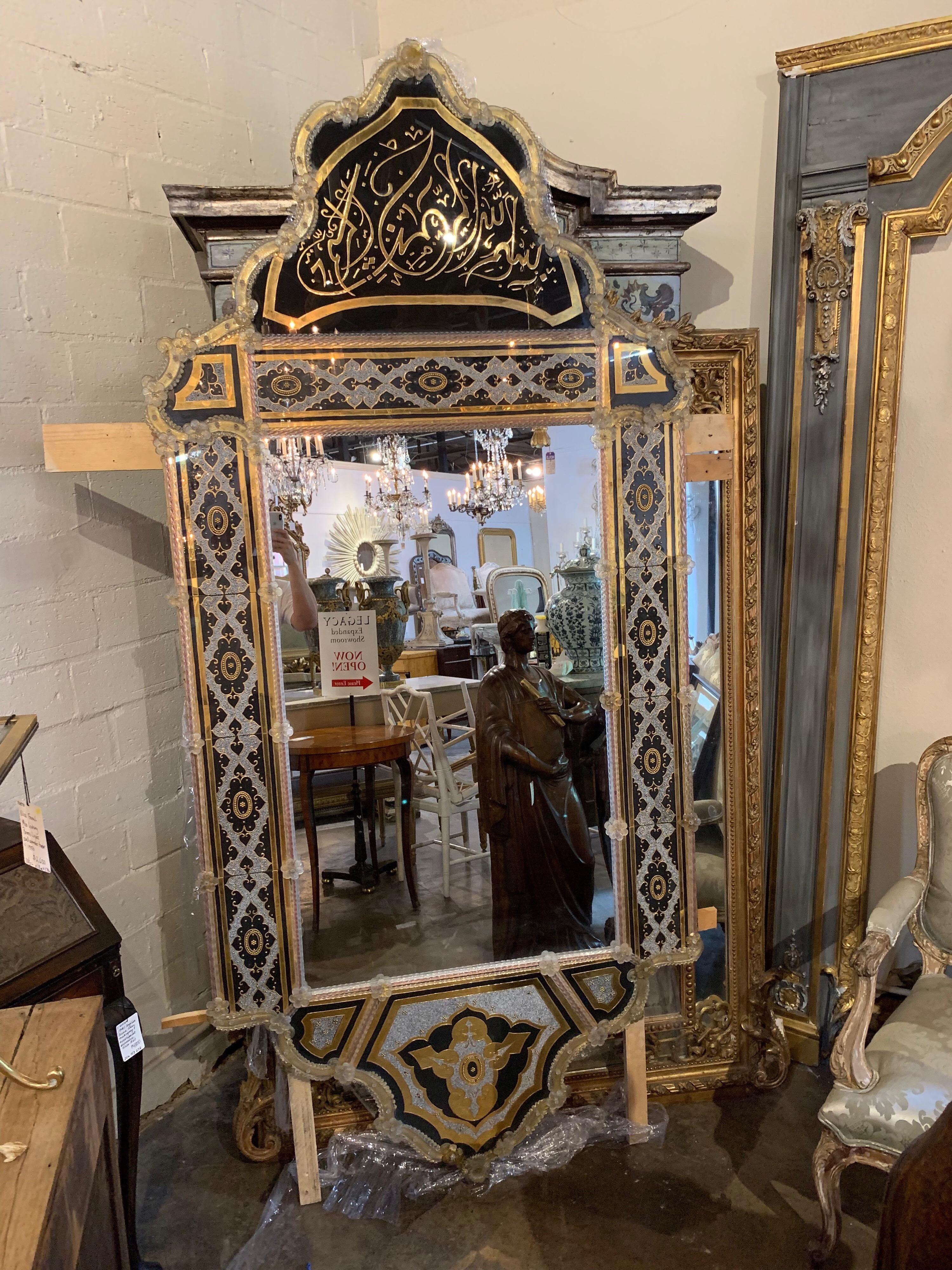 Incredible Venetian reverse painted mirror with enamel beads. The mirror has a very elaborate design and is very large in scale. It makes a very bold statement and is absolutely gorgeous.