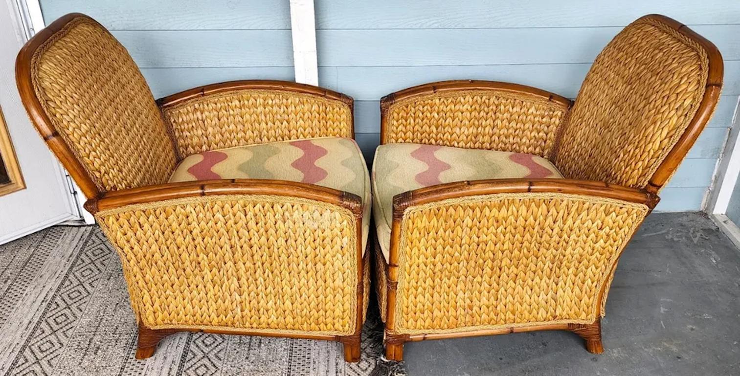 For FULL item description click on CONTINUE READING at the bottom of this page.

Offering One Of Our Recent Palm Beach Estate Fine Furniture Acquisitions Of A
Pair of Woven Banana Leaf Bamboo and Leather Rattan Strapping Lounge Chairs

Approximate