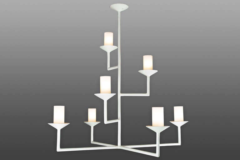 Seven-arm chandelier with a plaster of Paris finish. Glass tubes with white and clear fret conceal the light bulbs. Light uses seven candelabra based bulbs. Max wattage 60 watts each.