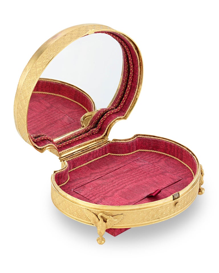 Outstanding decoration adorns this diminutive Palais Royal mother-of-pearl box, formed into a charming coquille shape. It is a wonderful demonstration of French Empire decorative arts, combining the classical forms and ornamentation of the Louis XVI