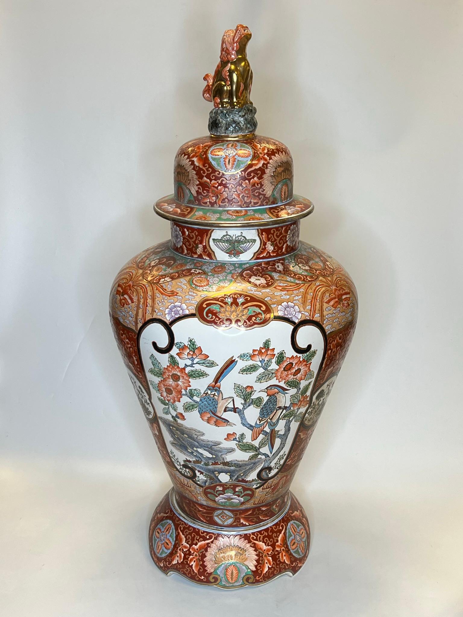Palatial 19th Century Chinese Porcelain Vase with Cover and Pedestal in the Qianlong style, with lovely floral and bird cartouches on rust red ground.  With Qianlong mark on underside of vase.