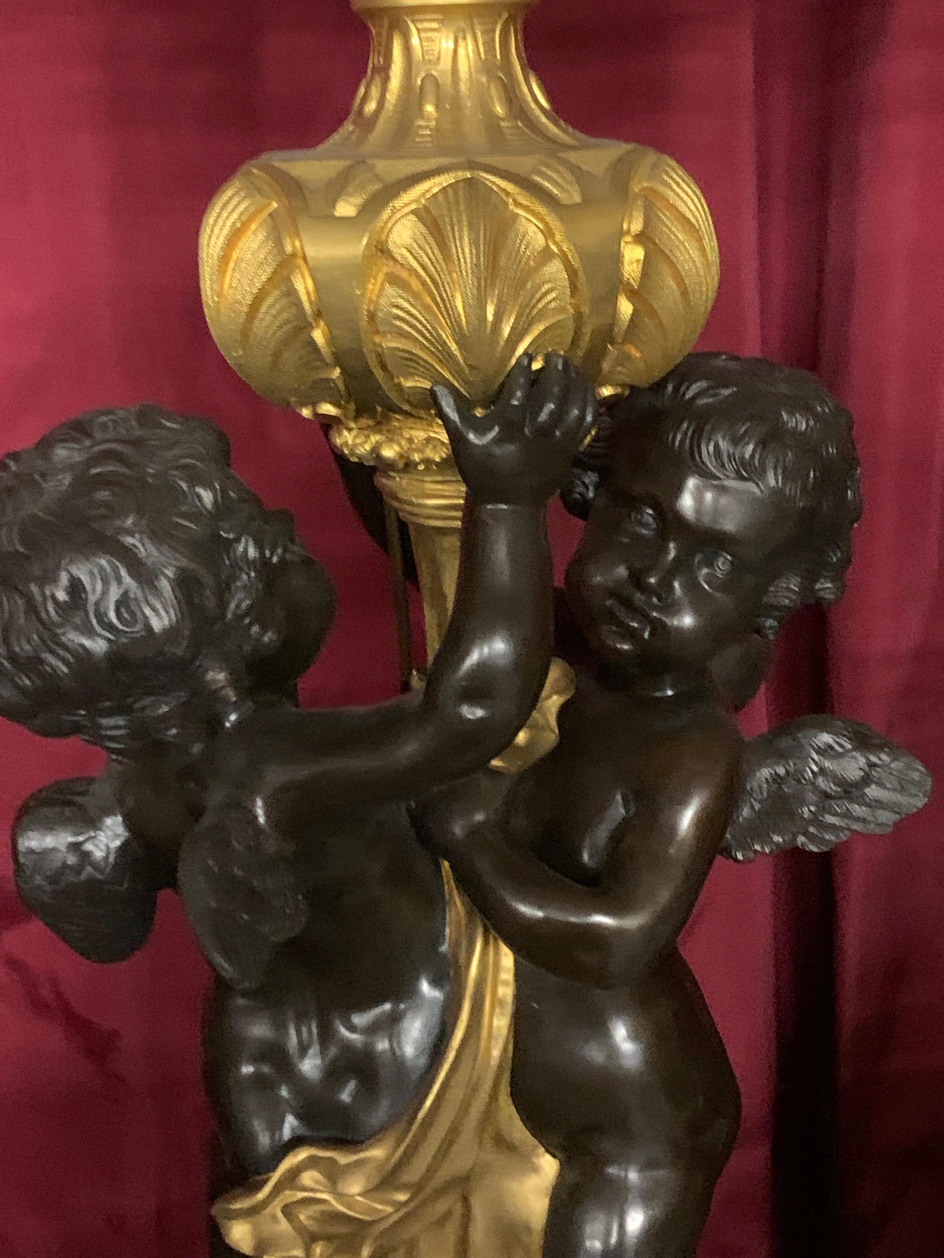French palatial  3 pieces clock set in bronze with cherub For Sale