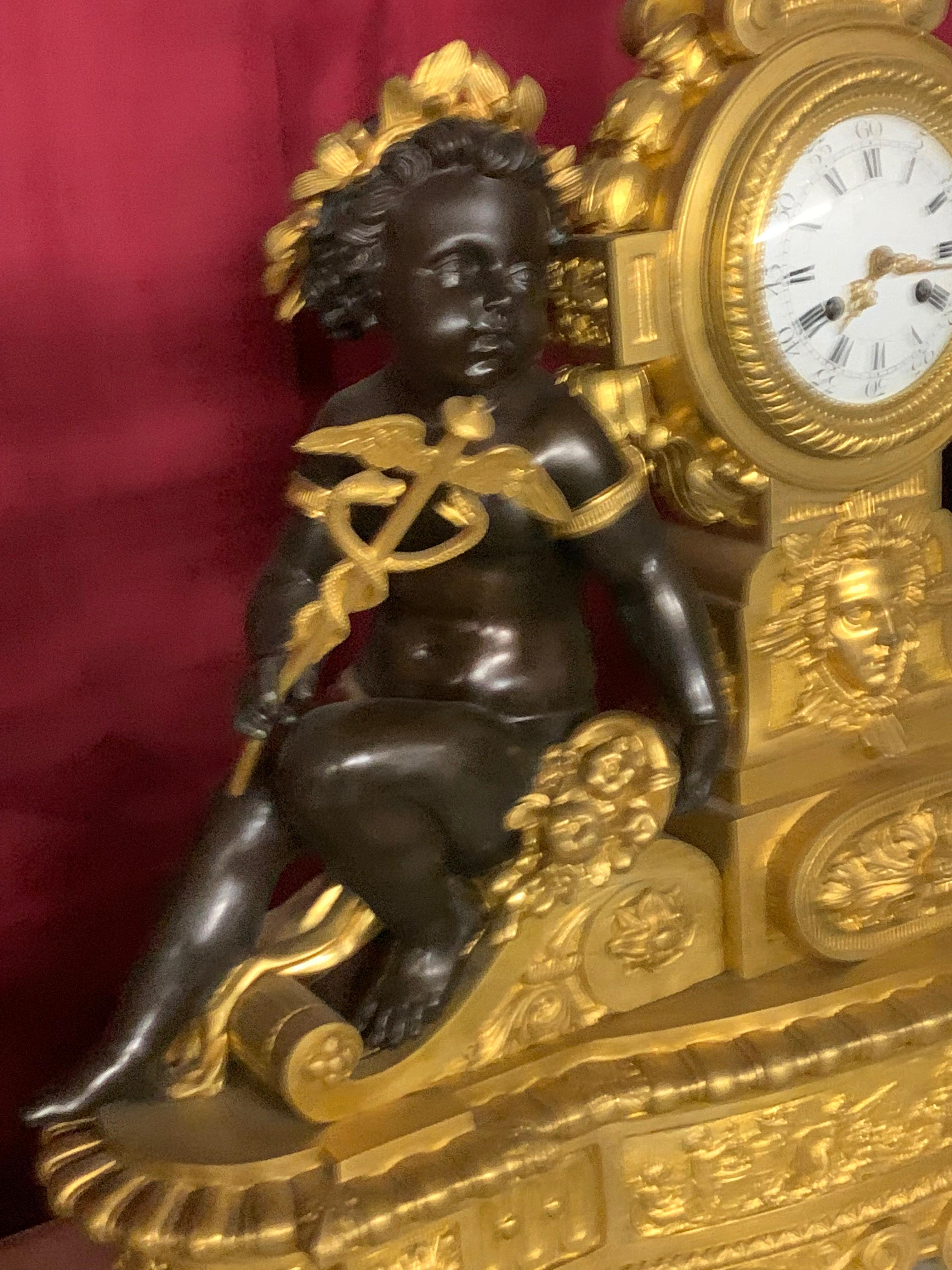 Bronze palatial  3 pieces clock set in bronze with cherub For Sale