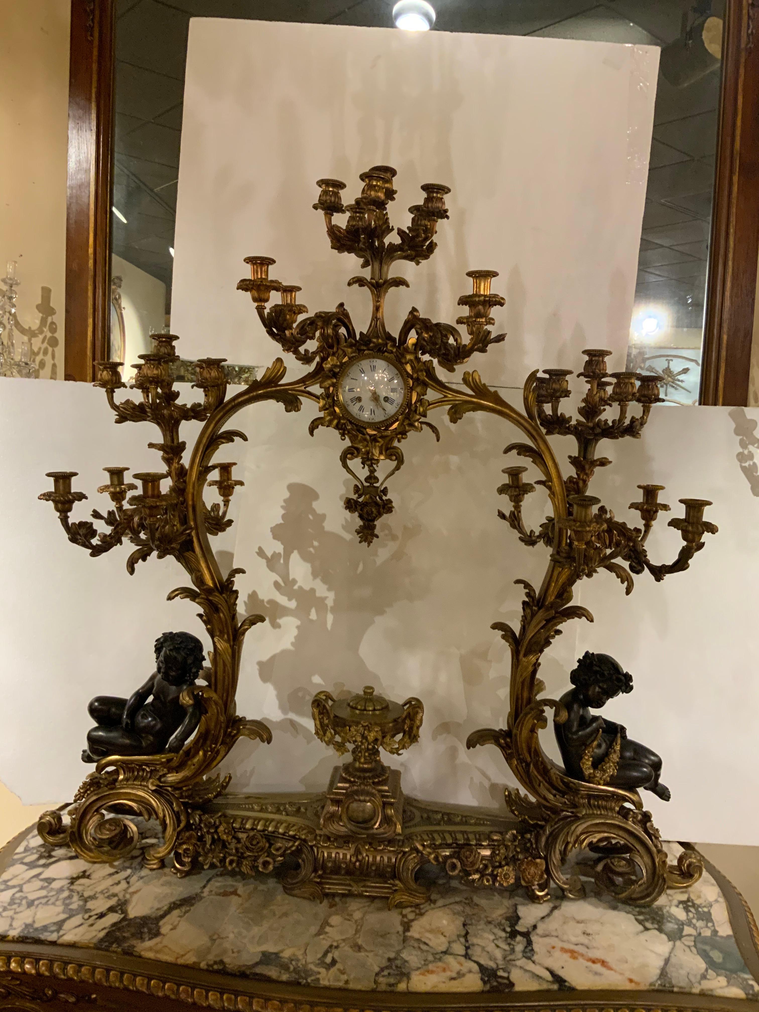 Gilt Bronze Doré and Patinated  French Clock with 26 Candelabrum with putti 6