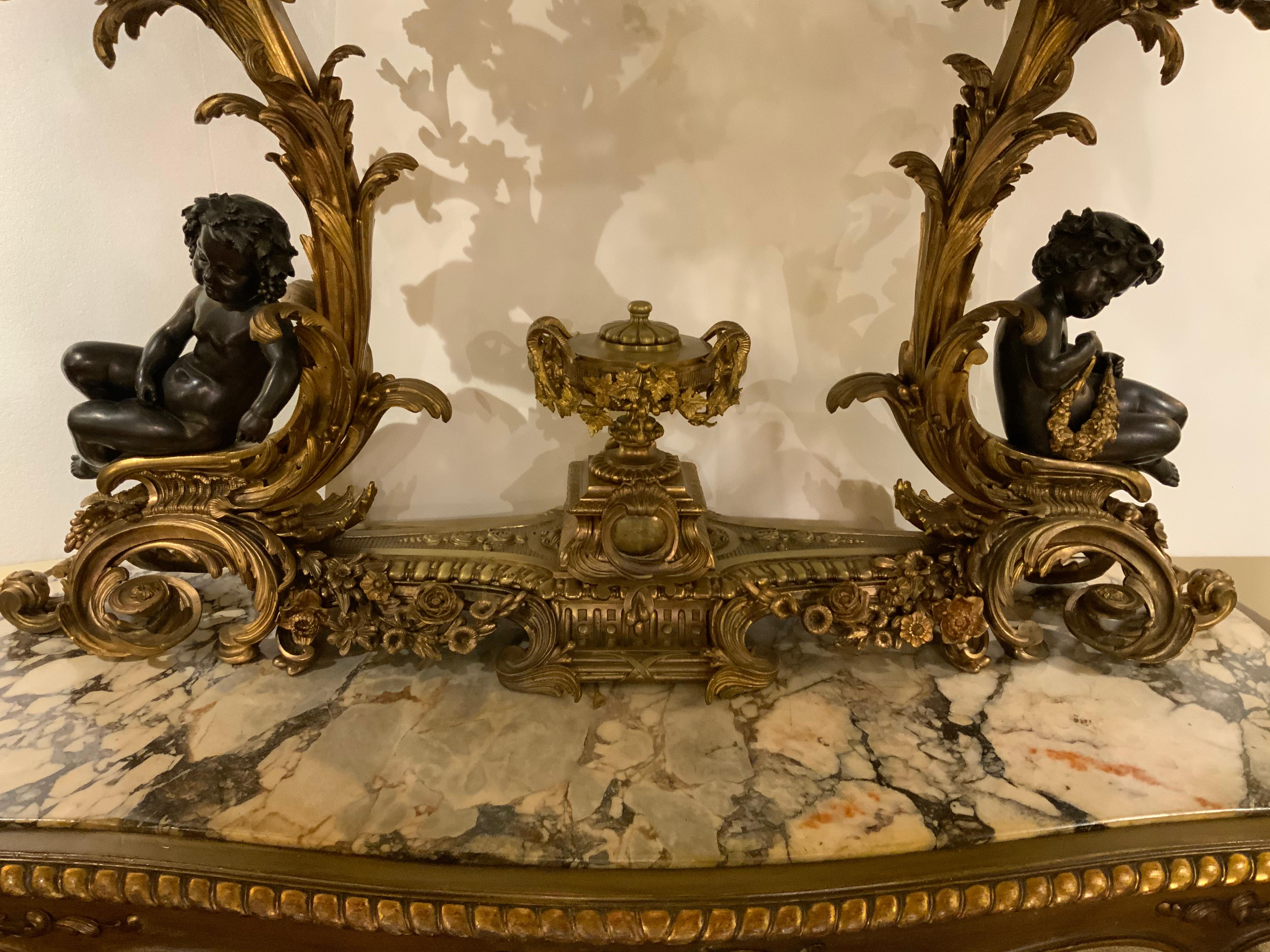 Louis XV Gilt Bronze Doré and Patinated  French Clock with 26 Candelabrum with putti