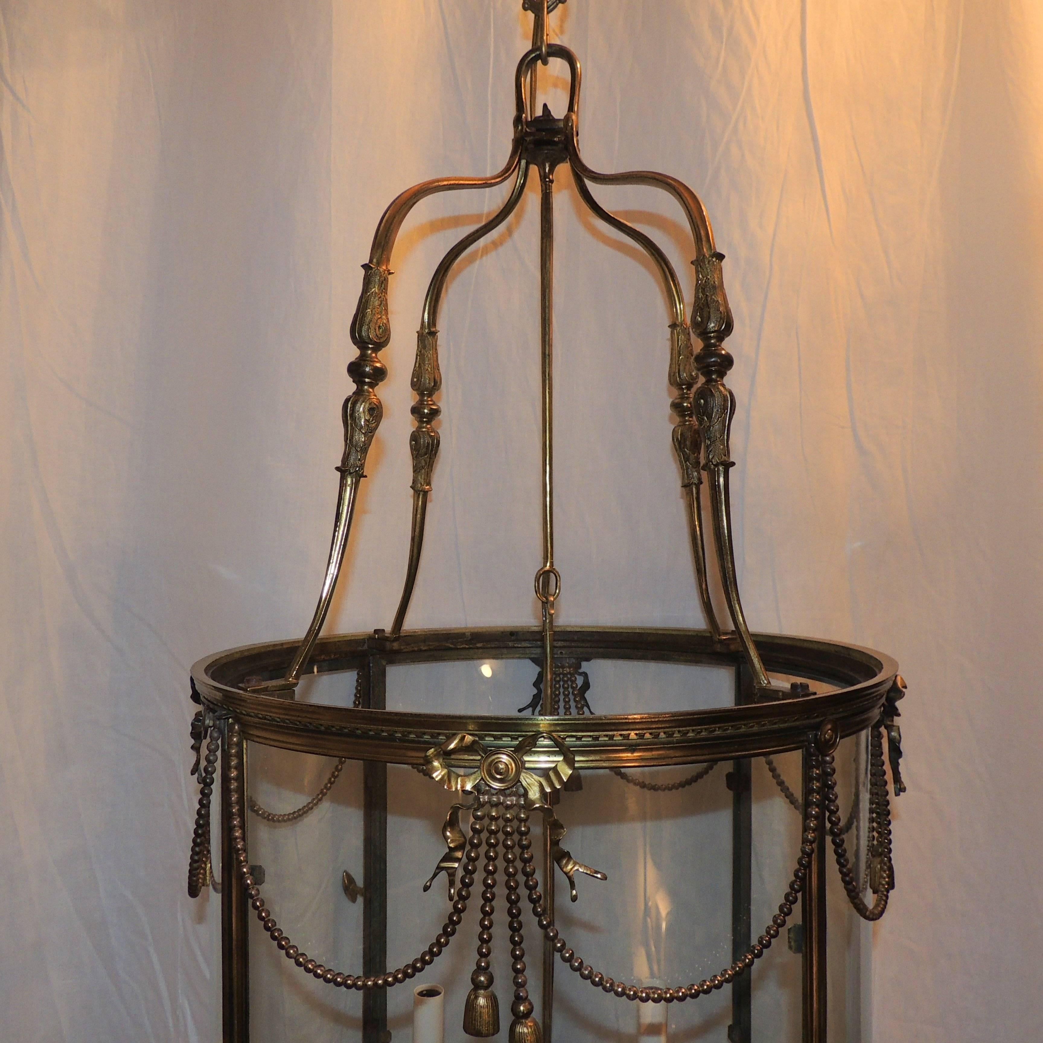 Palatial Large French Louis XVI Gilt Bronze Ribbon & Bow Swag Lantern Chandelier In Good Condition For Sale In Roslyn, NY