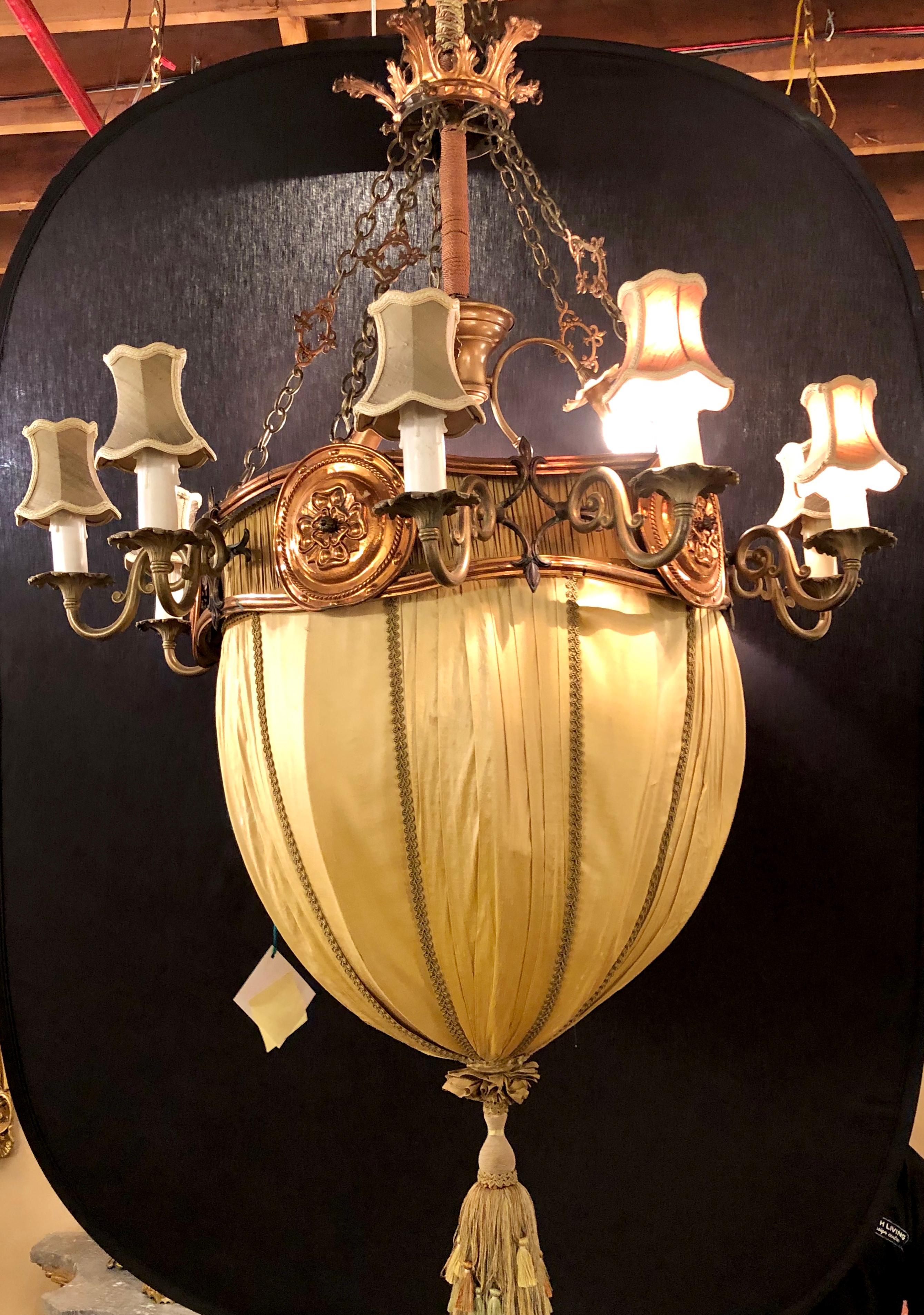 7 Foot High Hollywood Regency Light Fixture in Copper, Brass and Iron with Silk Dome Shade. This fine designer large and impressive chandelier has a copper drapery form frame with a domed lighted drapery material center cover terminating in a