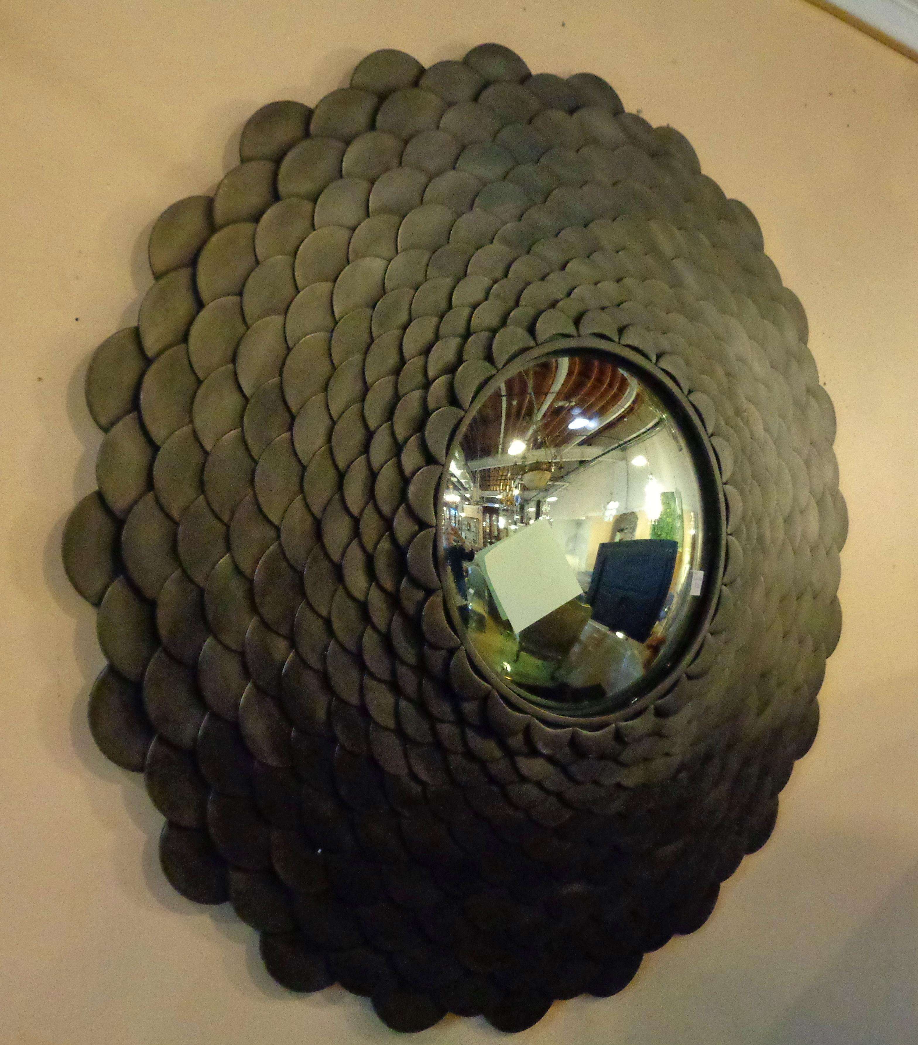 Palatial heavy large modernist steel fish scale wall mirror. Convex fish eye mirror. Decorator stepped steel frame. Dimensions: H 37.5 inches, W 37.5 inches, D 5 inches.