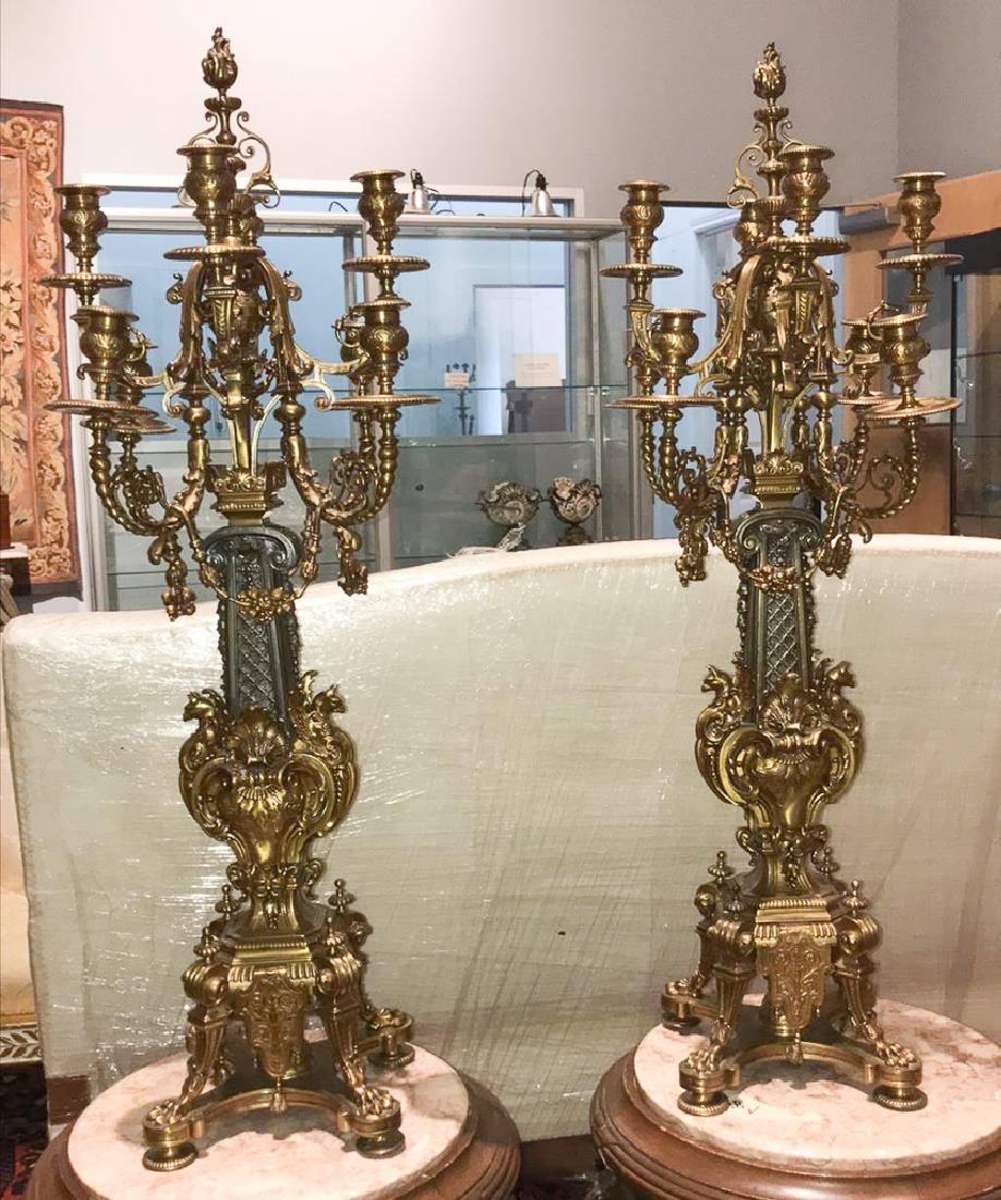 Phenomenal and palatial pair of antique French Renaissance Revival two-tone bronze eight-light candelabra with flame finials, festoon swags, acanthus leaf sprays, and animal claw feet. Remarkable detail overall.

Hard to find large size, 38