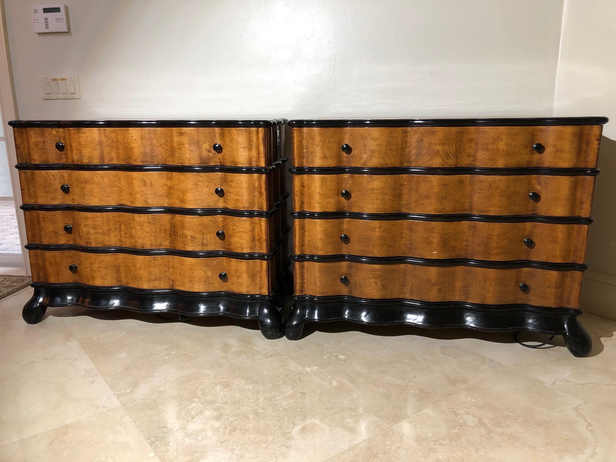 This pair of gorgeous walnut and ebony colored trimmed commodes or
chests are sublimely luxurious with serpentine undulating fronts and four roomy drawers. A nice perk they have outlets for lamps. Originally custom made for the Bellagio Las