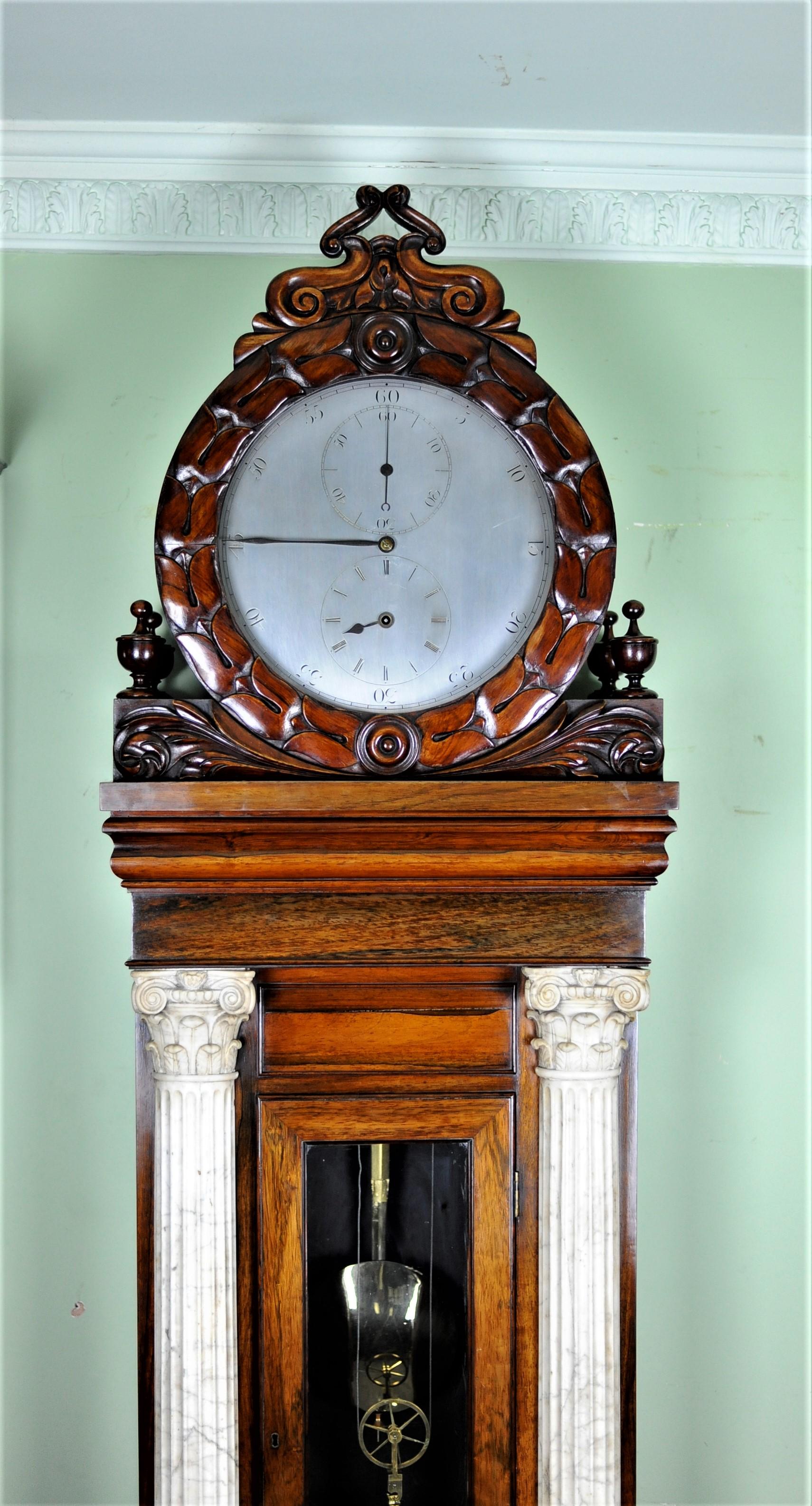 After 30 plus years being involved in clocks it is rare to see something totally unique that has not been seen before - this is certainly such a clock!
This magnificent item is made to the highest possible standards using Rosewood veneers only ever