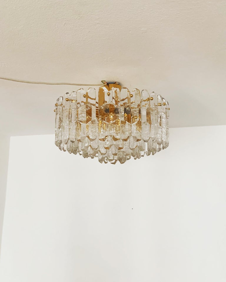 Wonderful and large ice glass ceiling lamp from the 1960s.
The 42 beautifully shaped Murano glass elements create an impressive, sparkling play of light.
Exceptionally high-quality workmanship.
Very noble and luxurious appearance and a real