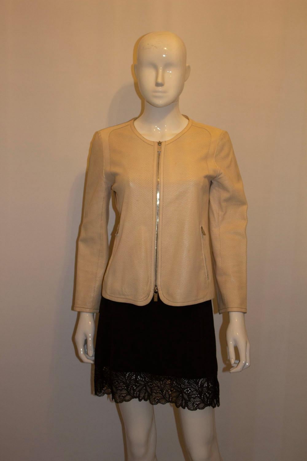  A super soft leather jacket by Celine. The leather jacket has a zip front opening , and two zip pocket, and zip cuffs. It has perforation detail on the front and has a round collar. 
Size 38 Measurements; Bust up to 36'', length 22'