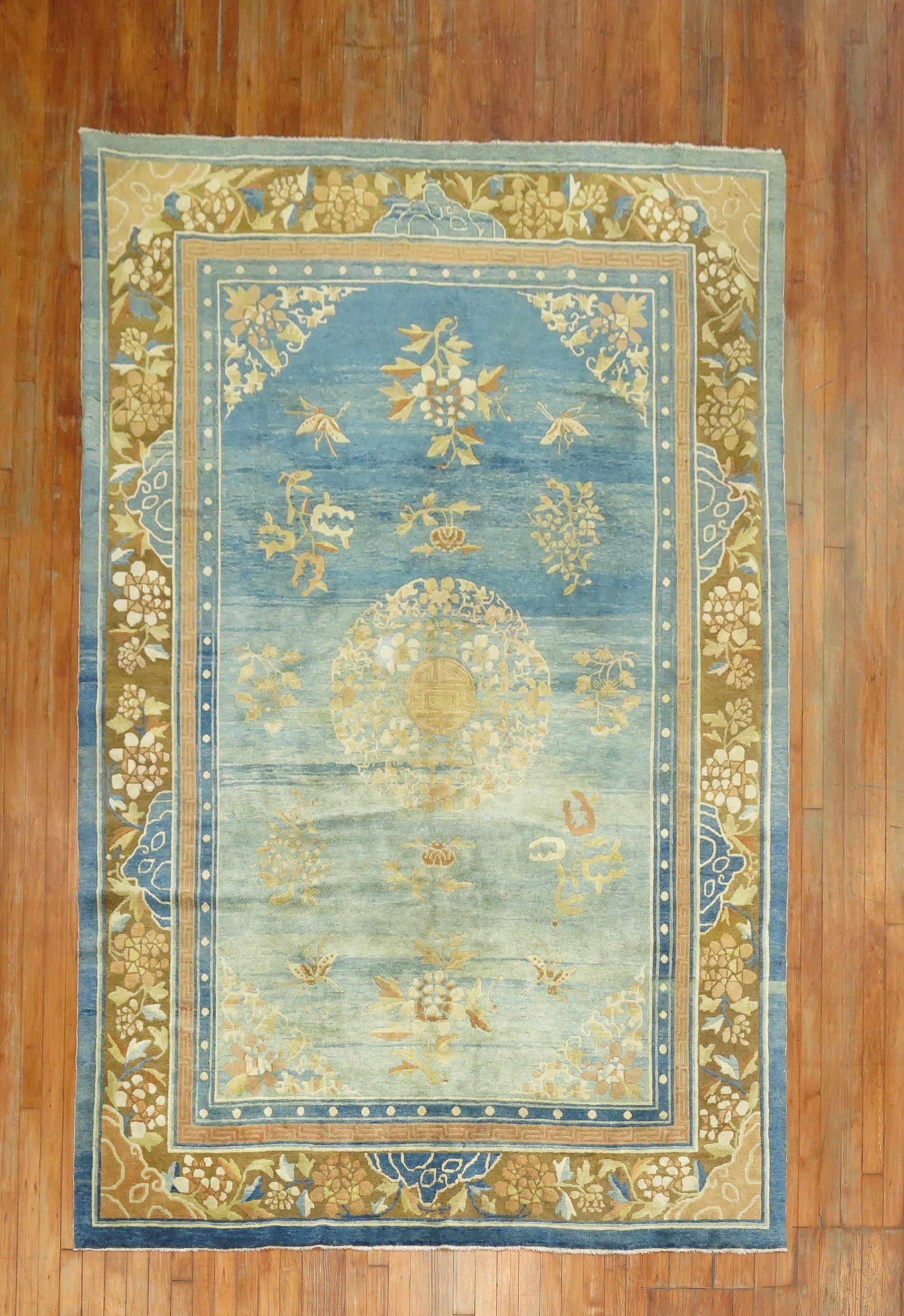 Enchanting early 20th century highly decorative Chinese Peking rug with an abrashed light blue field The wool and feel of the rug is very soft on the feet. It has a silky sheen to it as well.

6'3'' x 9'