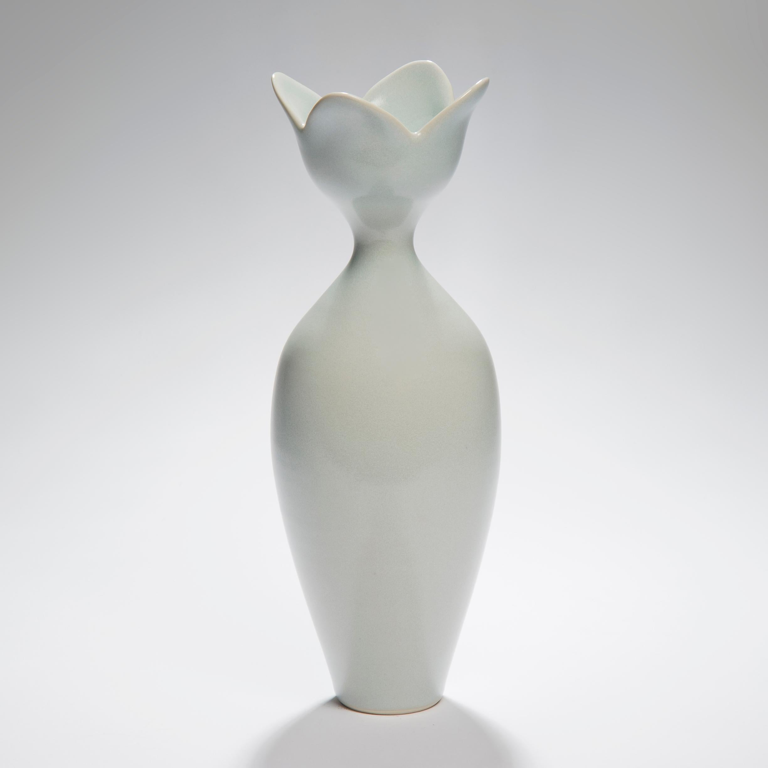 Pale blue flower, is a unique hand-thrown and glazed porcelain vase by the British artist Vivienne Foley, who produces exquisite, hand thrown, turned and glazed one-off pieces of ceramic sculpture. Although in essence they are often functional